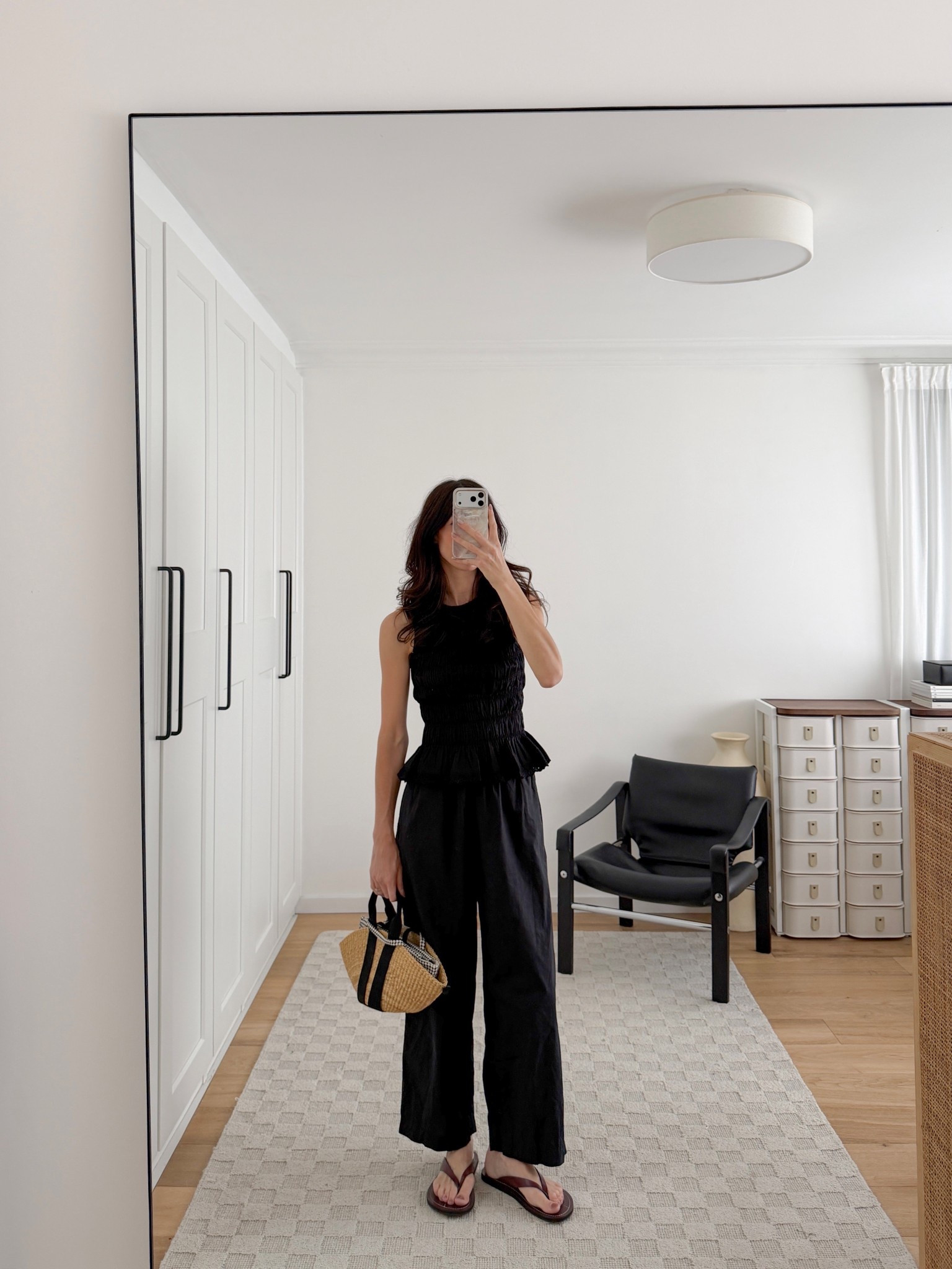 Will never tire of an all black look (even for spring/summer!). Love the shape the smocked peplum top adds to the look, too 👌🏻

Of course wearing a bunch of my @netaporter faves (including what is in my opinion the most underrated bag brand if you’re looking for a straw woven tote 😮‍💨)

Wearing top and pants in size S and shoes in my usual EU40