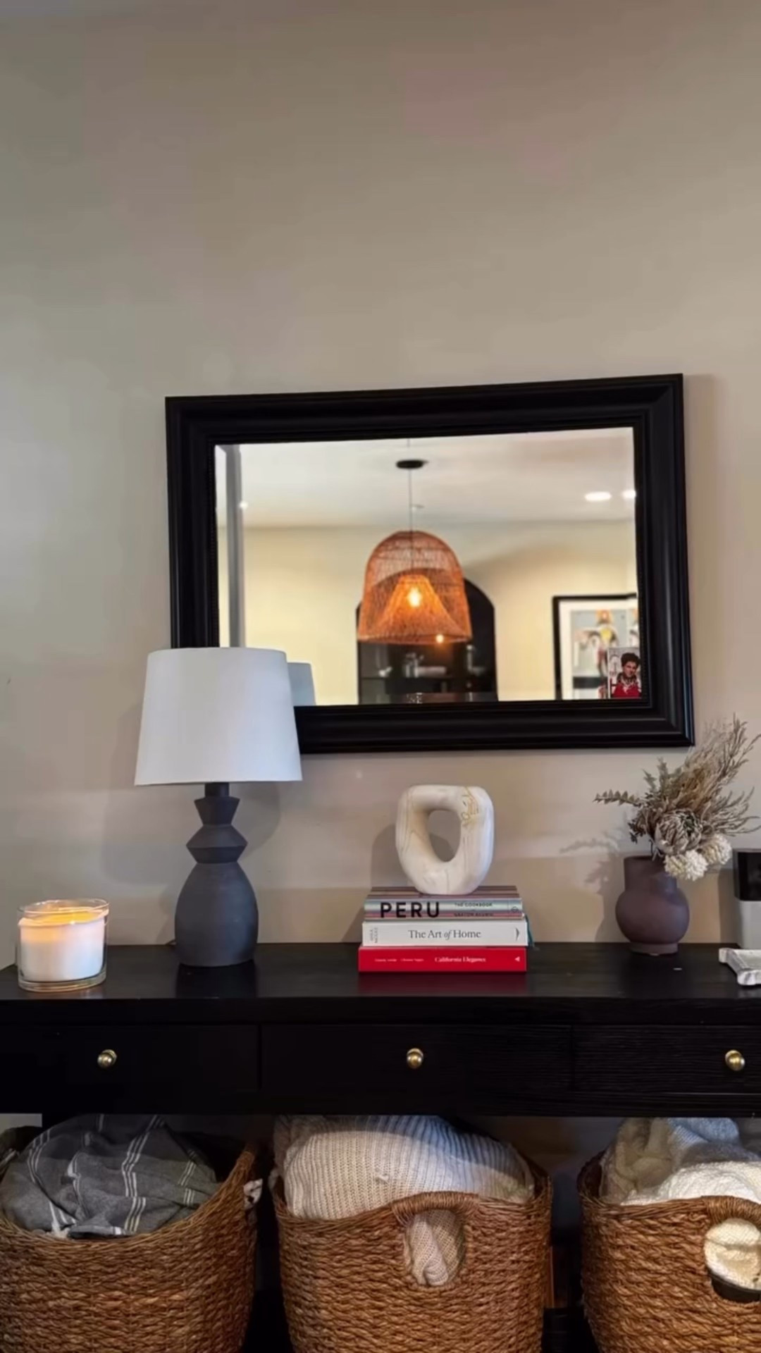 Super easy and affordable ways to make your entryway cozy - without knowing anything about design. 

Easy Style Tips for a Similar Look
   •  Console Table + Baskets: Pick a console with a lower shelf to display baskets neatly underneath ￼
   •   Natural Textures: Choose wicker, water hyacinth, rattan, or seagrass for baskets to add warmth and texture.
   •   Layered Decor: Place stacked books, a sculptural object, and a lamp on top for a styled vignette.
Pick a personal touch - like I added a cookbook Peruano because I’m Chilean and I love Peruvian food 

 

#LTKdayinmylife #LTKOver40 #LTKHome