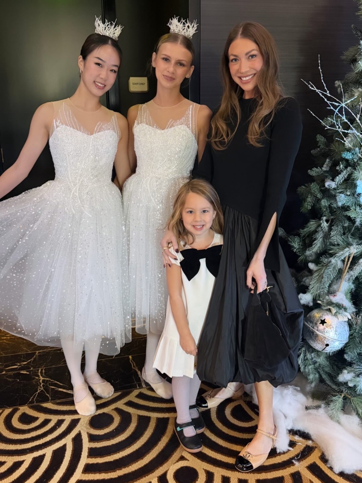 Stassi Schroeder's Black. This long sleeve mock neck midi combines a fitted top with a voluminous, gathered skirt, creating a striking contrast. The unique silhouette and mock neck design make it a standout piece.

Dress Fit: We recommend sizing down.