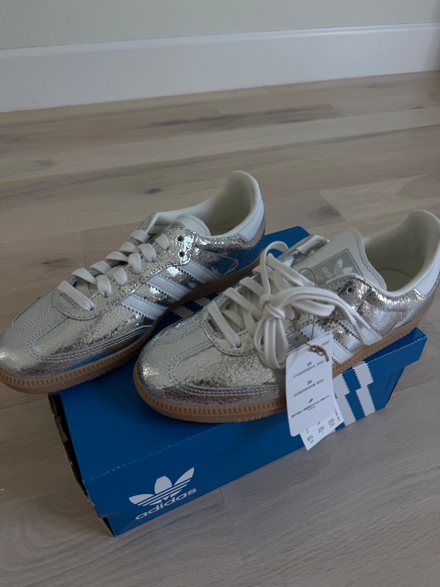 I size down half size in these! 

Summer sneakers, silver adidas 