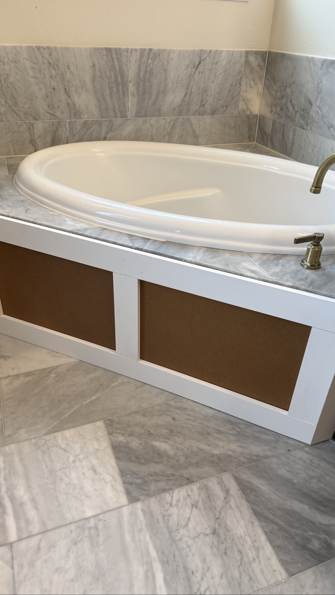 Crown moulding and bathtub skirt paneling for our bathroom makeover project

#LTKHome