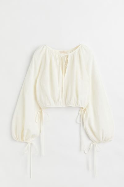 New ArrivalOversized, cropped blouse in a textured weave. Round, gathered neckline with a V-shape... | H&M (US + CA)