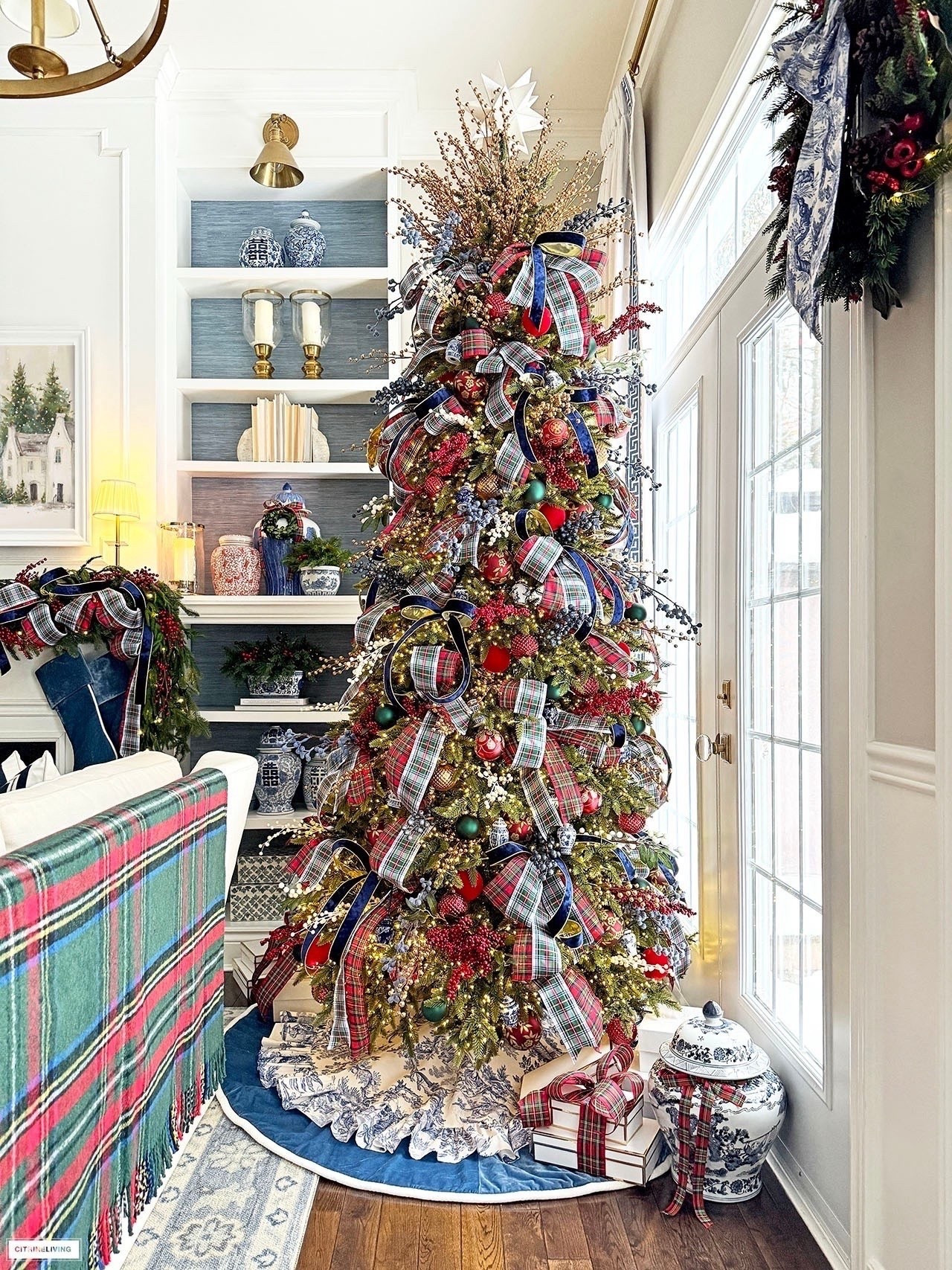 Gorgeous, classic Christmas in our living room last season! 

Layered plaid ribbons, velvet ribbon, stockings, and tree skirt, toile bows, and ruffled tree skirt, lush greenery and chinoiserie!

#LTKSeasonal #LTKHome