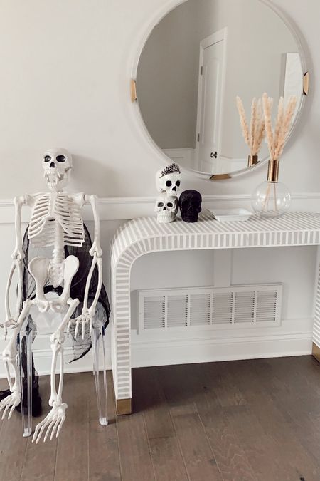 Halloween decor 
Halloween decorations 
Halloween 
Skeleton 
Life size skeleton 
Large Skelton 
Console table 
Skulls 
Pampas grade 
Entry way 

#LTKSeasonal #LTKunder100 #LTKunder50