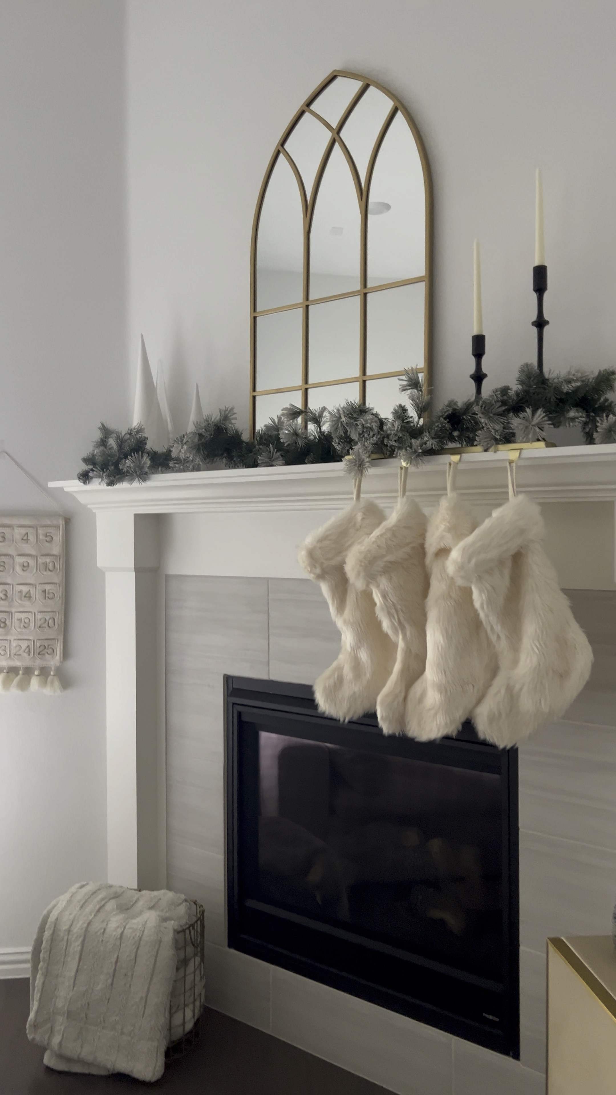 Christmas mantle decor. Christmas tree. Candleholders. Arch mirror. Garland. Stockings. Advent calendar. 

#LTKhome #LTKHoliday #LTKVideo
