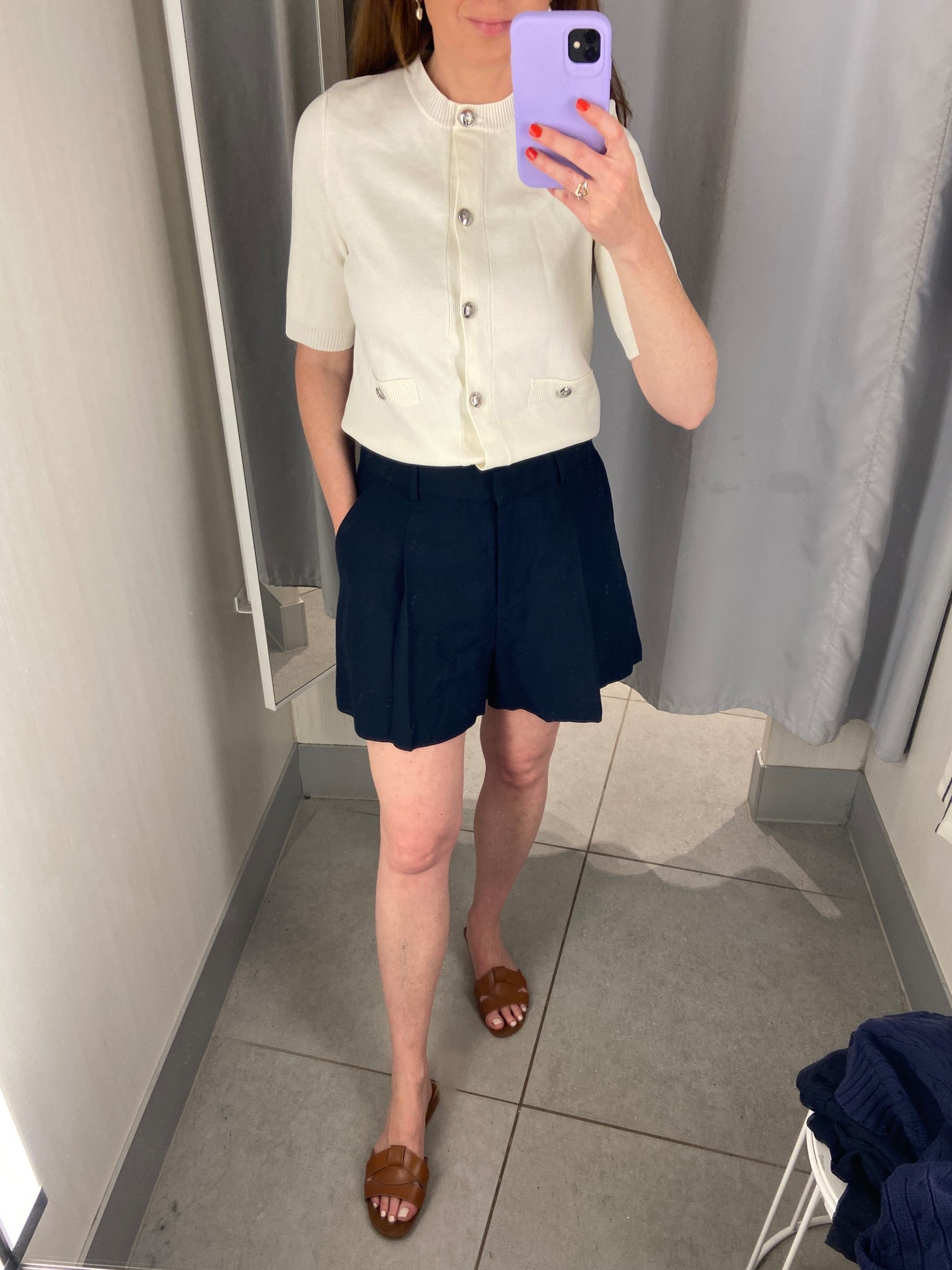 Effortlessly chic summer outfit from H&M featuring a short-sleeve cream cardigan with pearl-style buttons, tailored navy pleated shorts, and brown woven slide sandals. This polished neutral combo is perfect for warm-weather days — whether you’re headed to brunch, the office, or a casual outing. Easy to style and under budget, shop the full look now on LTK!


#LTKOver40 #LTKFindsUnder50 #LTKSeasonal