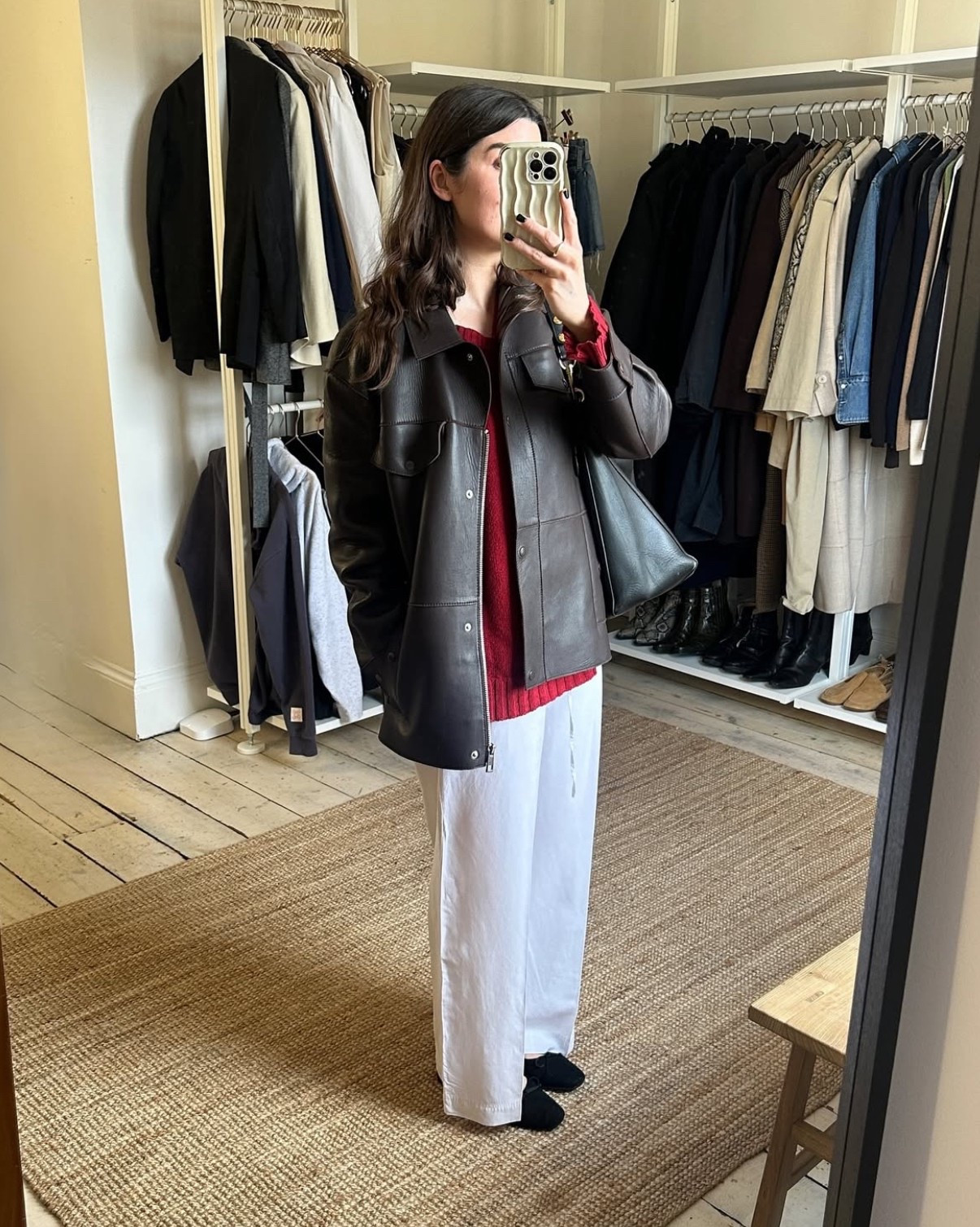 Styling an oversized Whistles leather jacket, Donni red v-neck jumper and Agolde white denim jeans

#LTKstyletip #LTKspring