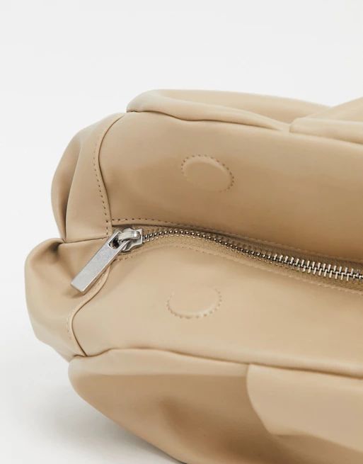 ASOS DESIGN oversized ruched clutch bag in beige | ASOS US