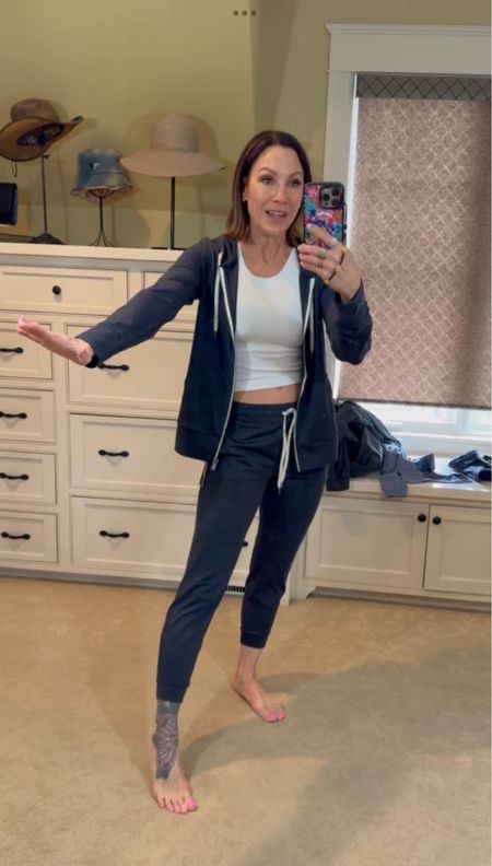 This matching set is so cozy and the perfect travel fit! I love being able to unzip or zip up a jacket while traveling. The material is buttery soft for all day comfort! Wearing a size small in the jacket and pants. 

#LTKstyletip #LTKtravel #LTKfitness