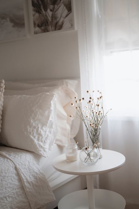 a simple white flower arrangement in the bedroom featuring dried ammobium (winged everlasting) flowers. 
—
home decor, minimal home decor, dried flowers, Etsy finds, dried flowers bouquet, flower arrangement, dried ammobium flower bunch, white flowers, daisy flowers, flowers for home, diy floral arrangements, dried flowers

#LTKhome