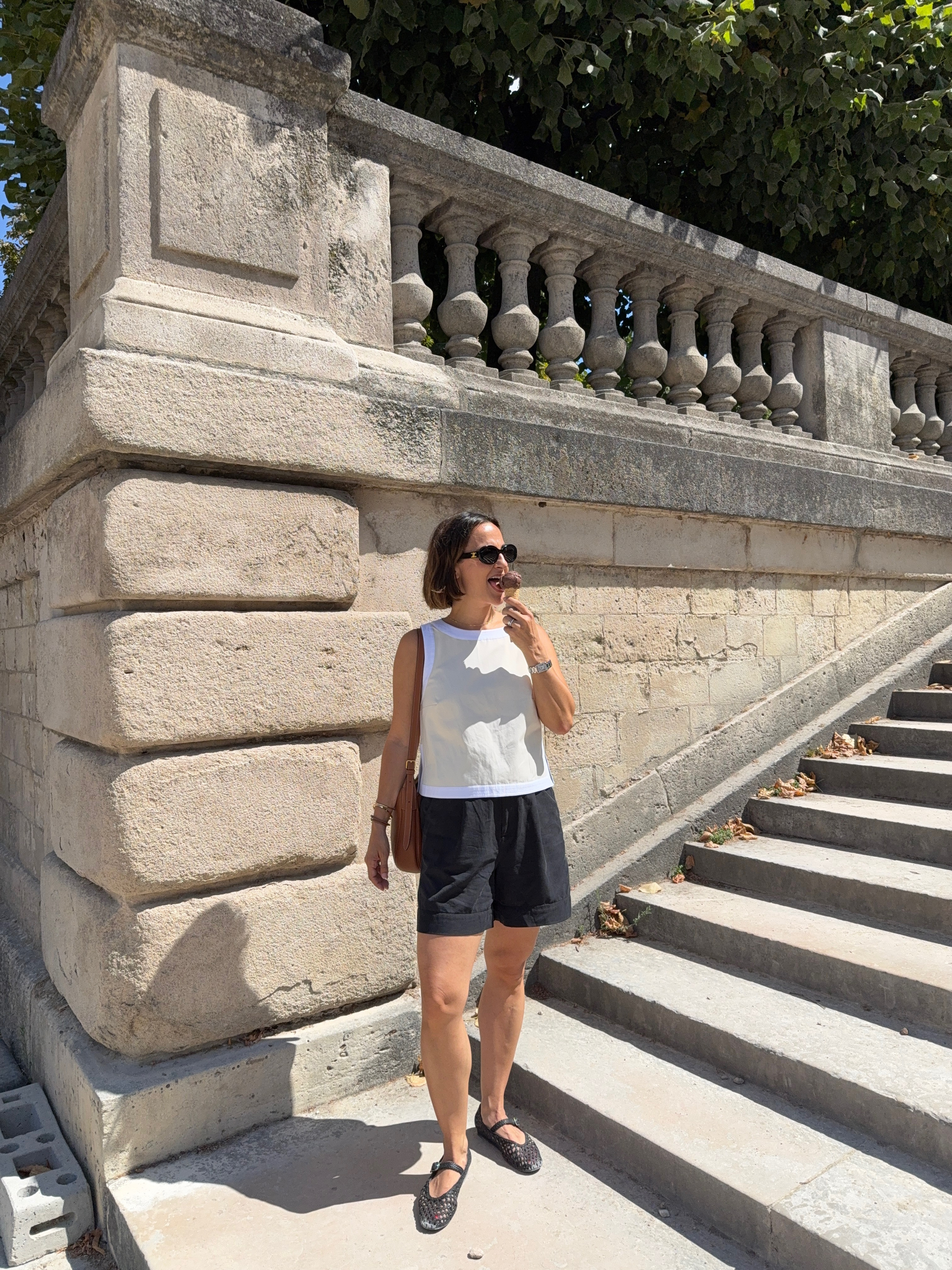 An easy warm-weather look for exploring Paris ☀️ I love the combination of a crisp white tank with relaxed black shorts, especially with woven ballet flats and a classic crossbody bag. Simple, comfortable, and perfect for sightseeing, grabbing lunch, and an afternoon gelato stop!  

 #LTKootd #LTKSeasonal