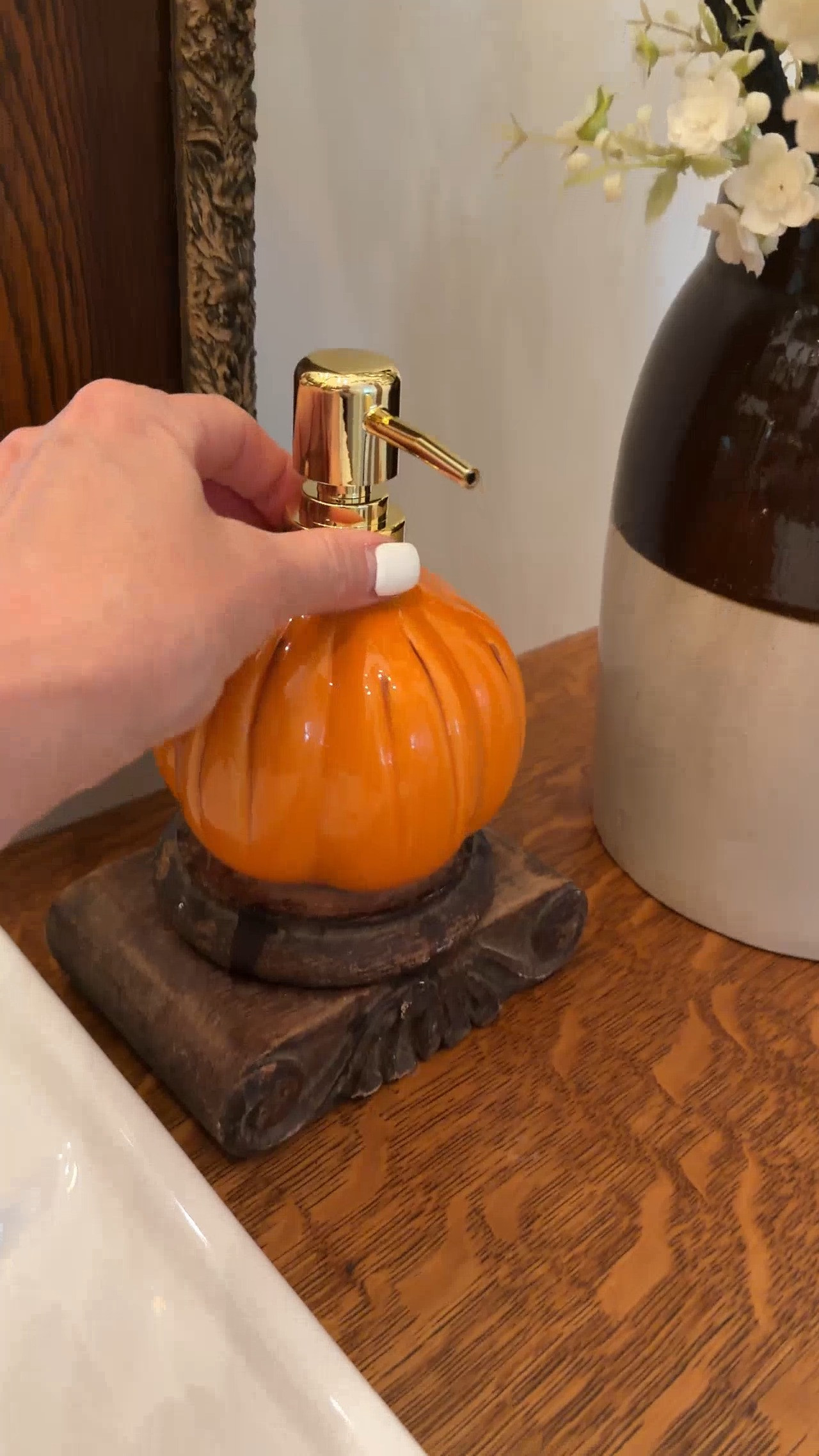An easy way to add seasonal decor to a bathroom is to add a seasonal soap dispenser. We just added this Halloween pumpkin soap dispenser. 

 #LTKSeasonal #LTKHome