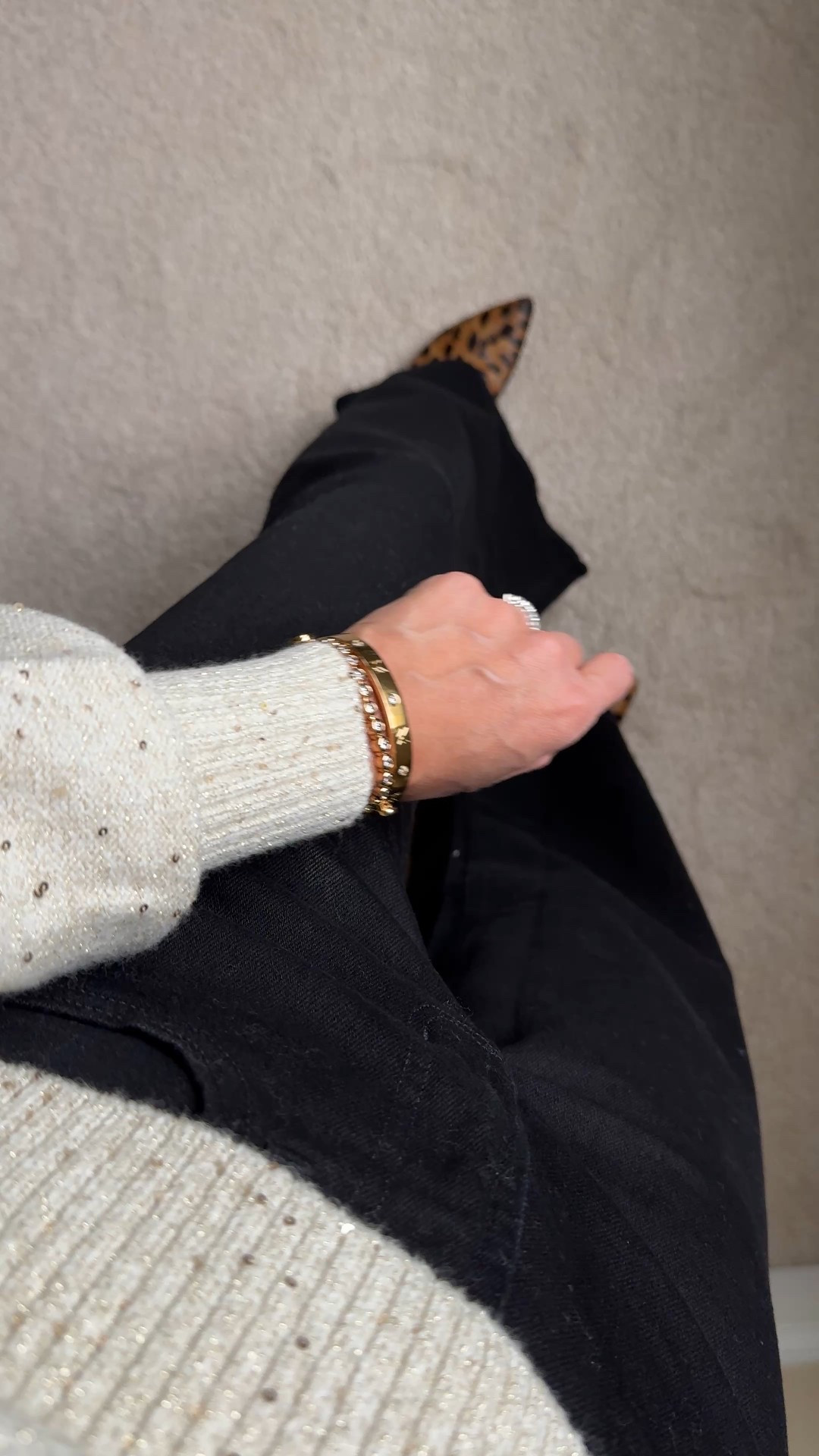 Easy casual chic festive outfit. 
If holiday red isn’t for you, a neutral holiday vibe is just as easy. 
-This embellished sweater has a pretty blousy feel to it. Feels effortlessly fancy with the subtle shimmer from the tiny sequins throughout. True to size for me. On sale for $36. 
-Black jeans that can pass for dress pants if you don’t really want or need dress pants. The high-waisted, wide leg silhouette is a flattering fit and feels elevated. Stretchy denim material.  True to size and in regular length here; could also wear petite length for flat shoes. On sale for $48. 
-Simple gold jewelry for more shimmer. 
-Leopard print shoes for interest. 


#LTKHoliday #LTKOver40 #LTKFindsUnder50