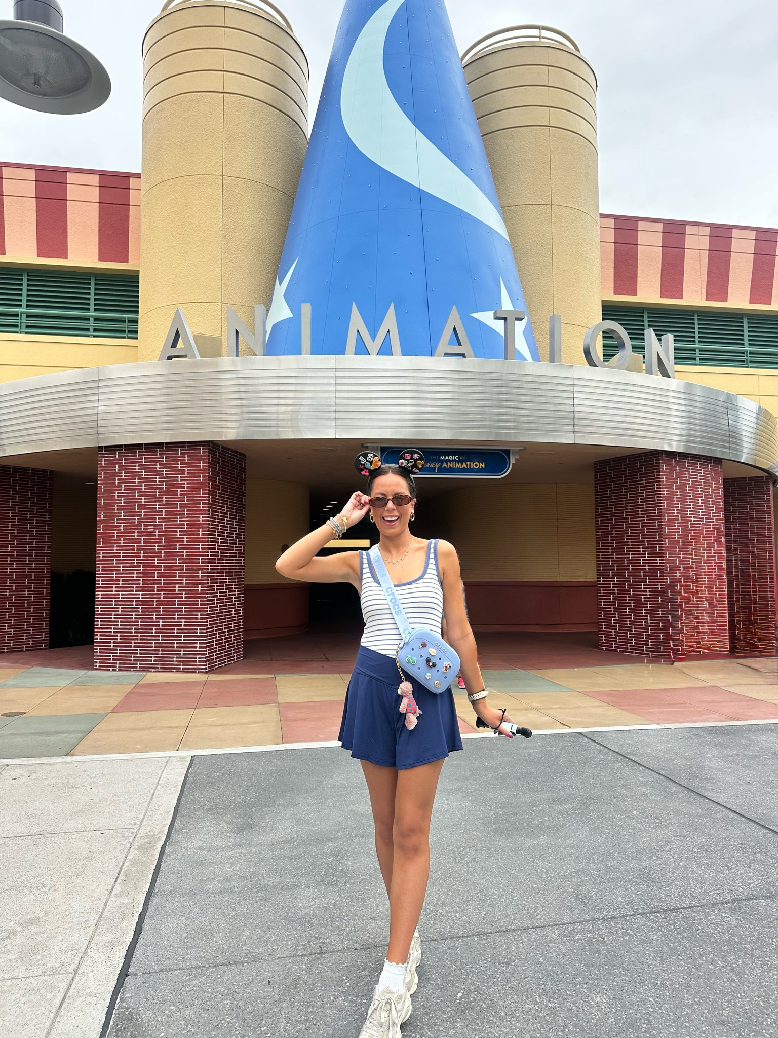 Comfy Disney ootd🩵 Amazon stretchy navy athletic shorts, active shorts, Abercrombie bra free padded stripe tank top, crocs Mickey Mouse ears, crocs Fanny pack, Disney bag, Disney accessories, Disney style, Disney girl, Amazon sunglasses, Disney jewelry, Reebok chunky sneakers #disney 

#LTKootd #LTKSaleAlert #LTKxAbercrombie