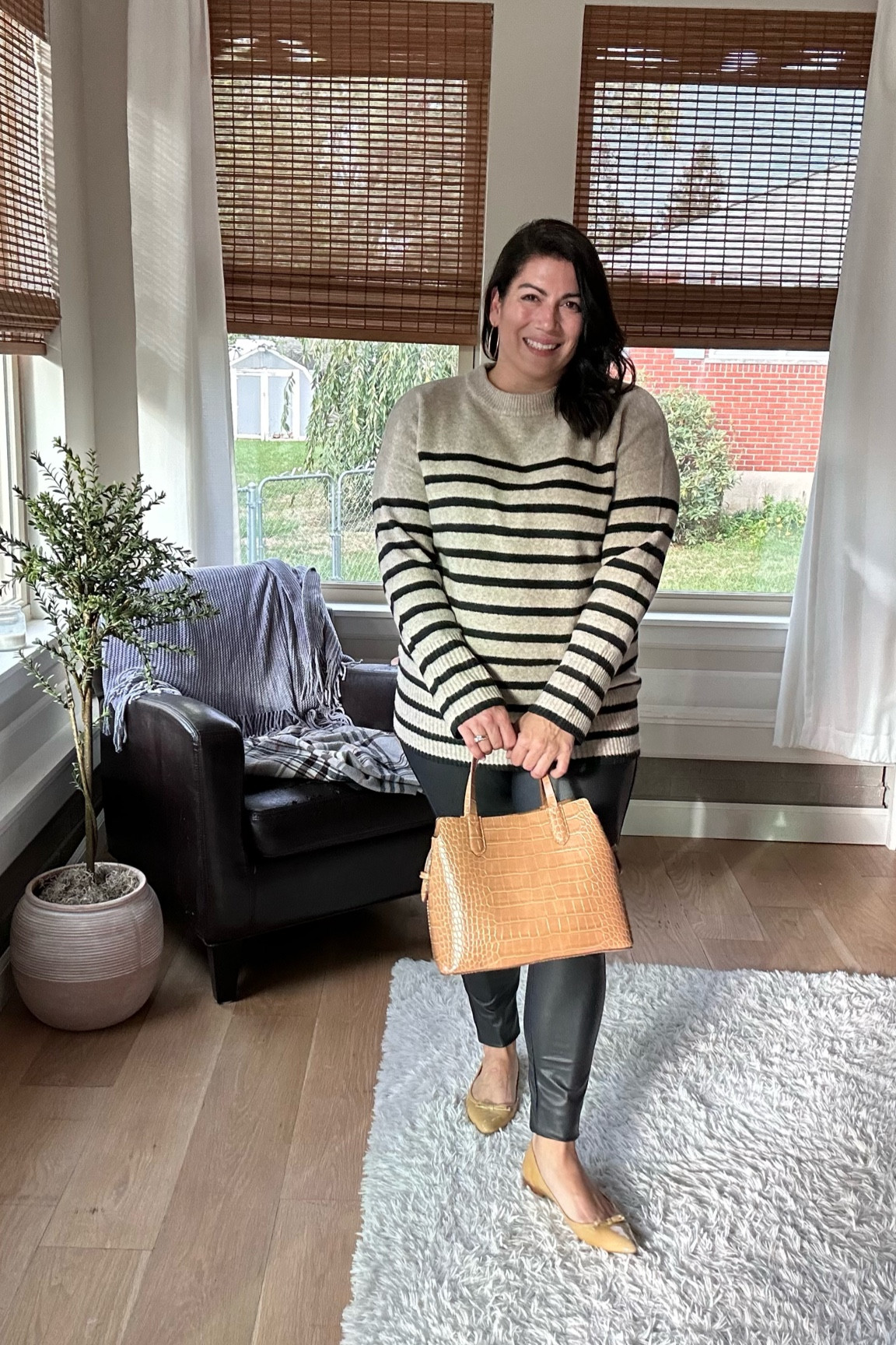 Time and Tru Faux Leather leggings - XL. I could have sized down for a tighter fit. They are long. I rolled them under at the ankle. 
Striped Sweater from Target - I’m in a large.

#LTKSeasonal #LTKfindsunder50 #LTKover40