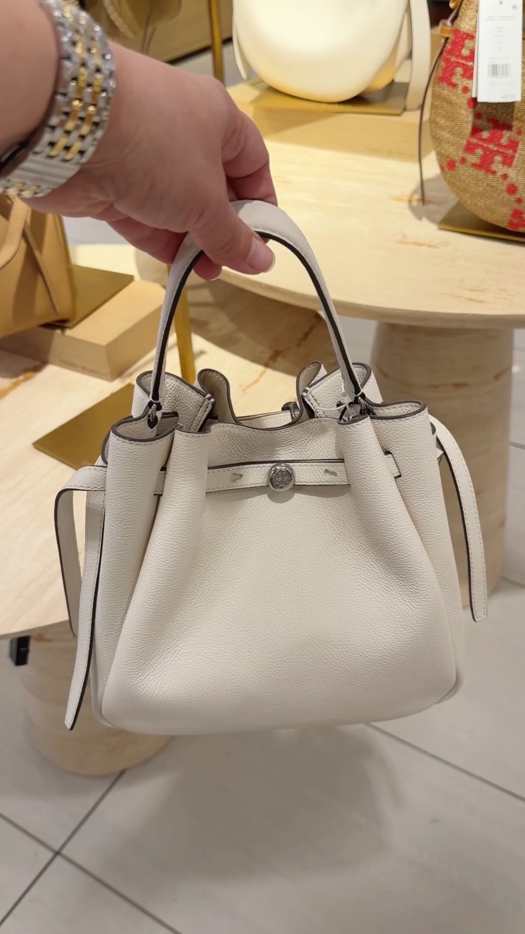 Love this Tory Burch bucket bag style in this light cream ivory color for spring and summer! Lots of other new Tory Burch bags for spring and summer available too including raffia, straw and crochet styles that are perfect for vacation outfits and resort wear. Always love the classic pebbled leather colors for everyday wear, workwear and travel outfits. Great gift for Mother’s Day! 

#LTKTravel #LTKMothersDay #LTKWorkwear