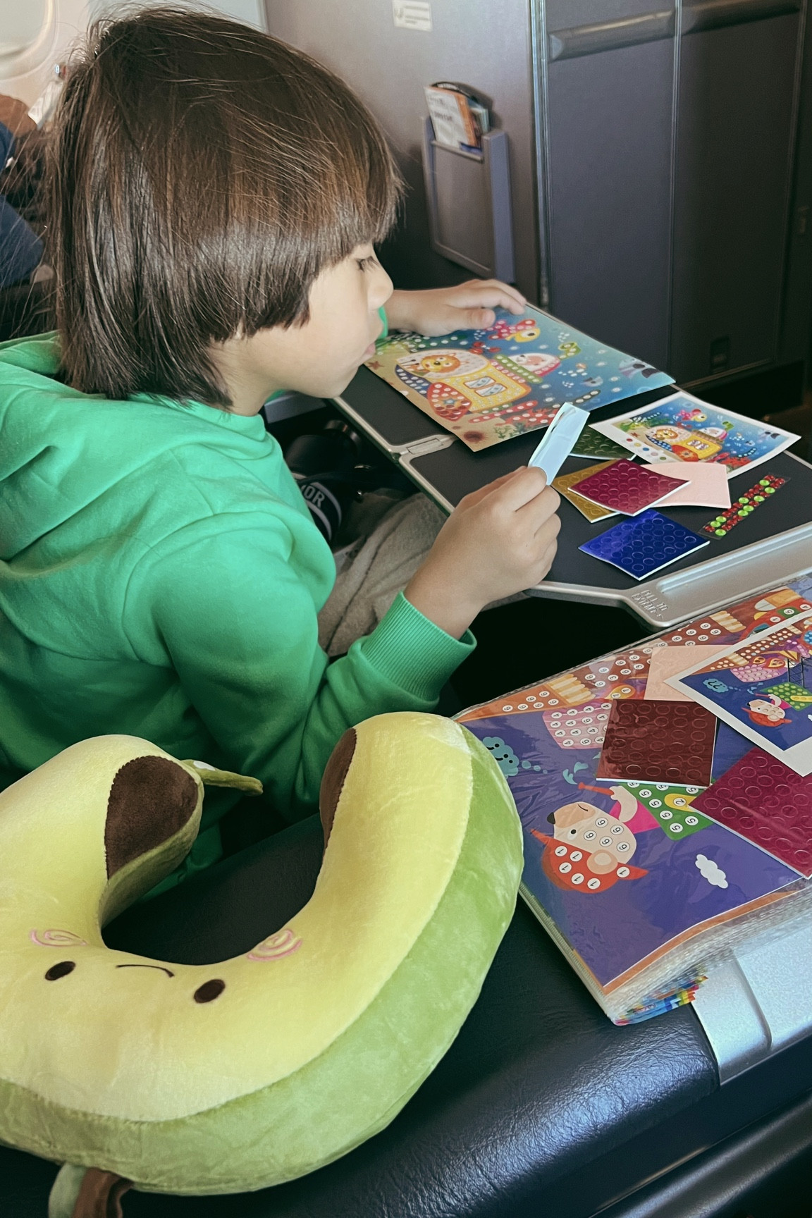 Kids sticker art that he loves! We were going through major turbulence and he had no care! He was so into this! 

#LTKunder50 #LTKkids #LTKtravel