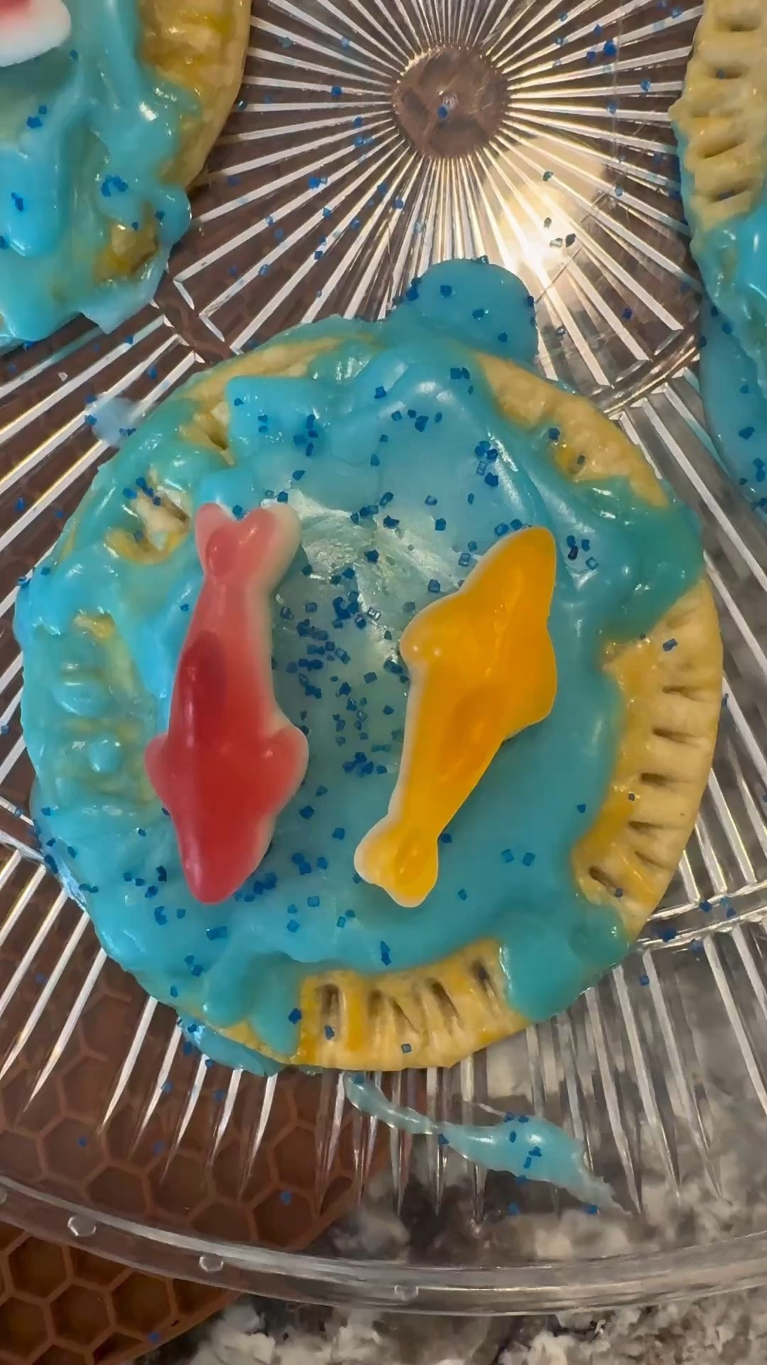 Snack time just got a whole lot jaws-ier 🦈💙 These homemade Shark Tarts are made with flaky pie crust, filled with sweetness, topped with ocean-blue icing, and finished with gummy sharks for the cutest summer treat! Perfect for beach week, shark parties, or a fun kitchen activity with kids.

You need: 
Pie crusts
Strawberry jam 
Egg wash
For icing:
Powdered sugar
Water
Blue food coloring
Top with: 
Sprinkles
Gummy sharks

homemade pop tarts, shark tarts, shark week treats, shark themed dessert, gummy shark dessert, easy summer treats, kids baking ideas, pie crust recipes, homemade toaster pastries, blue icing dessert, fun food for kids, beach themed snacks, shark party food, ocean themed dessert, cute summer snacks, easy dessert recipe, kid friendly desserts, baking with kids, viral dessert ideas, themed party treats, seasonal recipe ideas

#LTKKids #LTKHome #LTKSeasonal