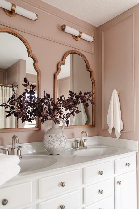 Primary bathroom makeover with mauve pink walls and arched wooden mirrors 🪞 

#LTKFind #LTKSeasonal #LTKhome