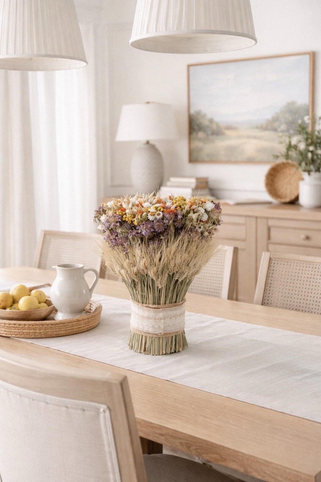 Add a touch of vintage charm to your home with the Wildflowers and Lace Stack, a beautifully layered bundle of dried green wheat, safflower, lemon mint, and delicate ammobium daisies. Finished with burlap and soft lace for an heirloom-inspired look, this handcrafted botanical piece brings warm texture and timeless countryside elegance to mantels, tables, or shelves. A lovely accent that celebrates the quiet beauty of dried wildflowers. #ltkhome #ltkstyle #driedflowers #wildflowerdecor #cottagecore #vintageinspired #botanicaldecor #farmhousestyle

#LTKSeasonal #LTKHome