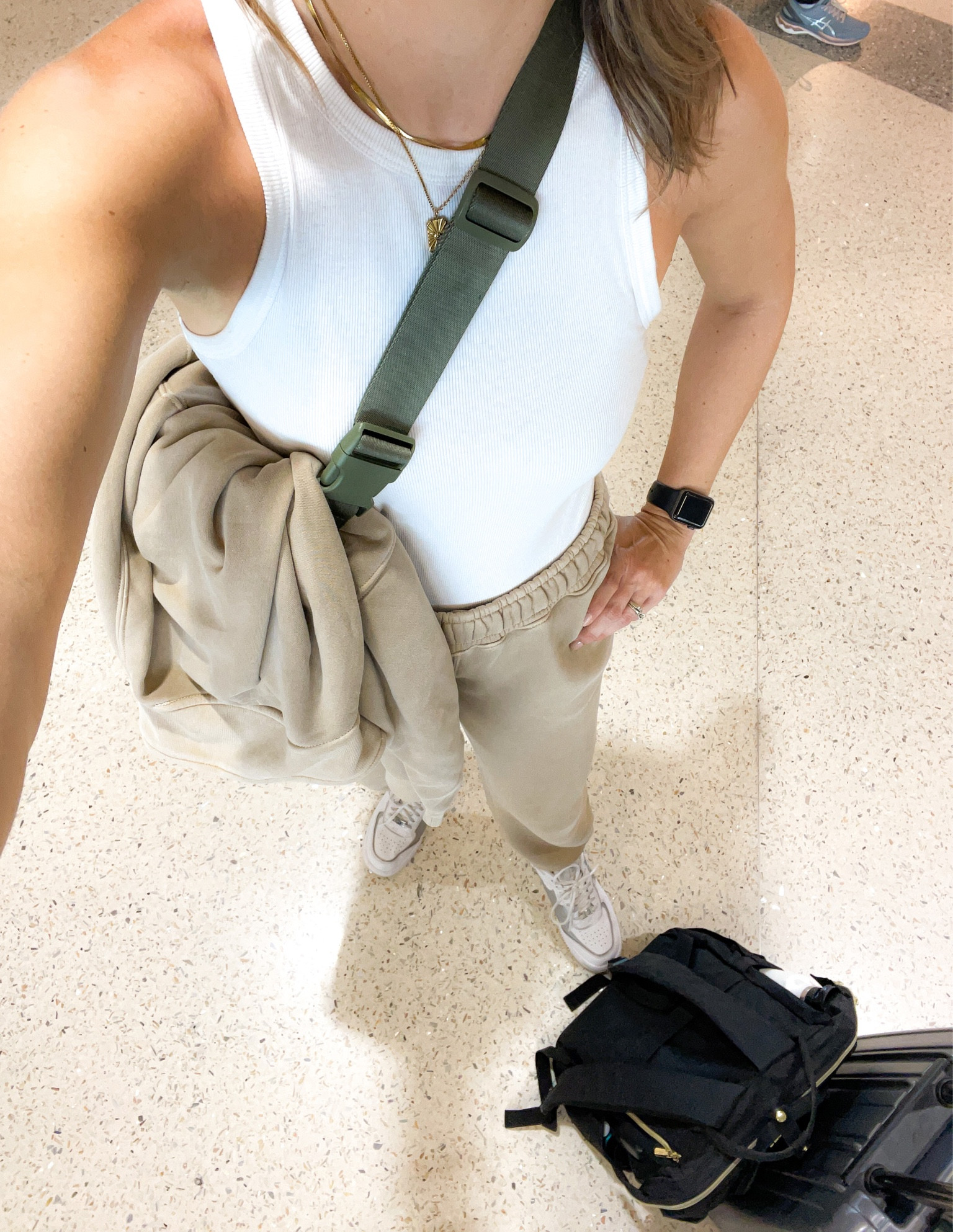 Travel Day! My must haves…comfy and cute matching sweat pants and sweat shirt travel outfit, belt bag, tennis shoes, and my travel backpack big enough for my 17 inch laptop and filming gear. 

#LTKover40 #LTKtravel