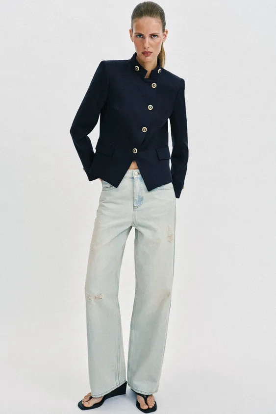 Long sleeve blazer with a high neck and shoulder pads. Front flap pockets. Front closure with gol... | Zara US