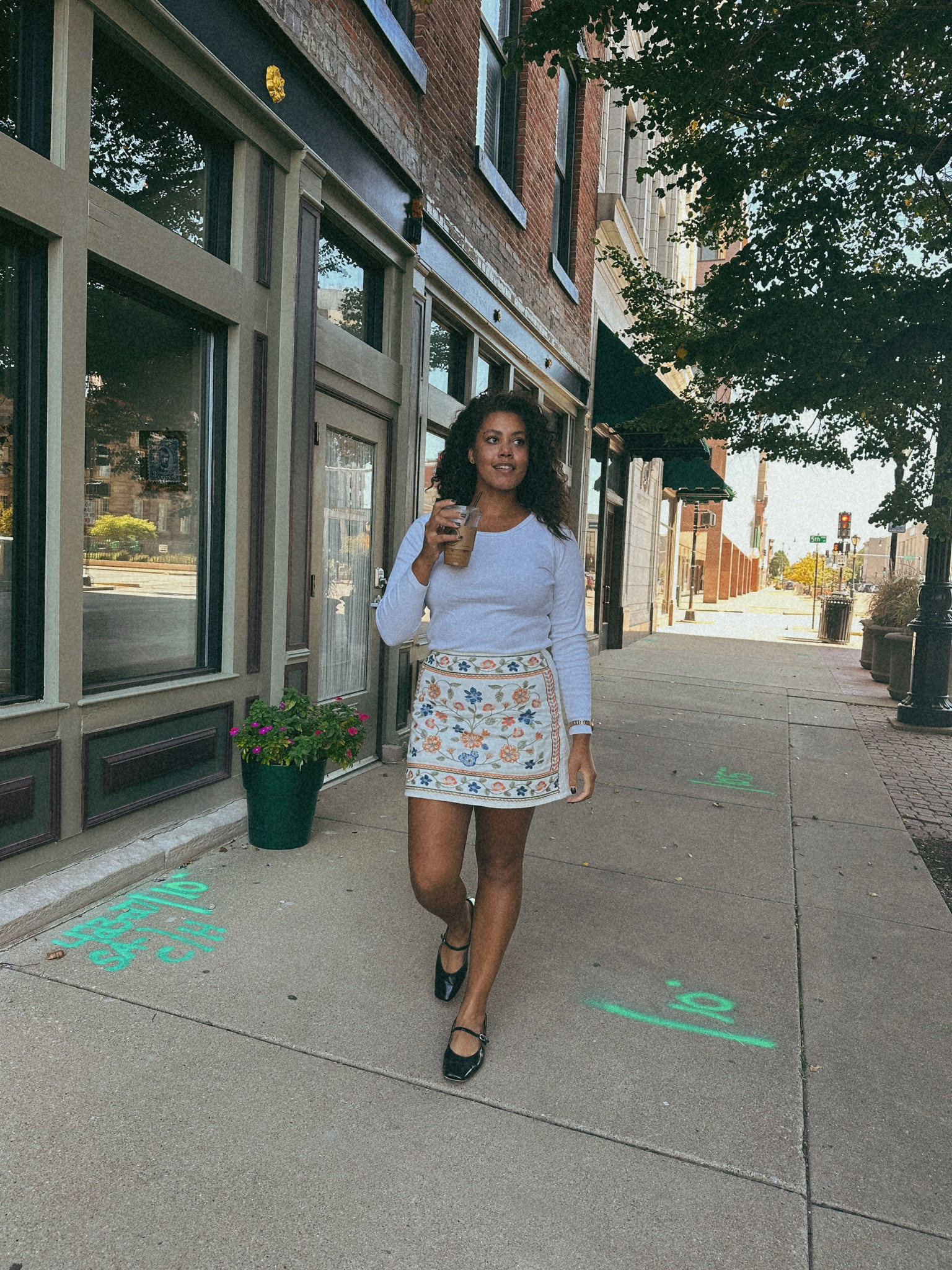 Floral mini skirt and ballet flats paired with a long white tee #fallfashion #style #outfitinspo 

#LTKstyletip