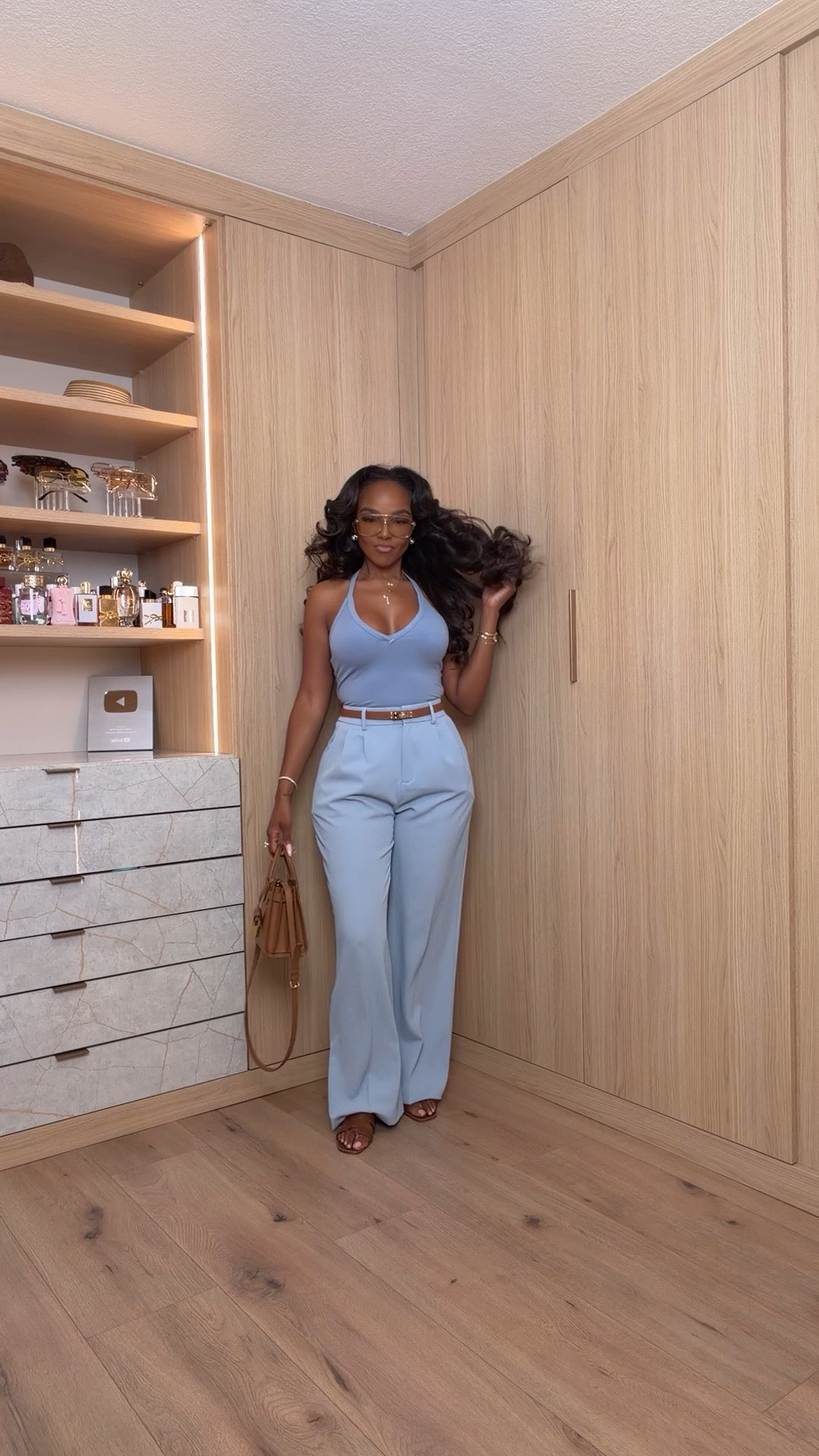 Hi Babes!

This powder blue set is the definition of looking expensive without trying. The tailored trousers create such a long, flattering silhouette while the fitted halter top balances everything perfectly. Paired with warm brown accessories, this outfit feels timeless, polished, and straight out of a luxury summer collection.

I love outfits like this because every piece can be styled so many different ways. The trousers work beautifully with bodysuits, blazers, and tanks, while the top pairs effortlessly with denim, linen shorts, or skirts for endless outfit options.

Where to wear this:
• Brunch with the girls
• Summer date nights
• Vacation dinners
• Bridal showers
• Baby showers
• Networking events
• Rooftop cocktails
• Special celebrations

Undergarments: A nude adhesive bra or seamless plunge bra works best with the neckline, paired with seamless nude underwear.

Everything is linked below.

xx Kira | IG: KirasFashionFinds

34D - 27 - 40 • Size Small or 4

Follow me on Instagram and YouTube @kirasfashionfinds