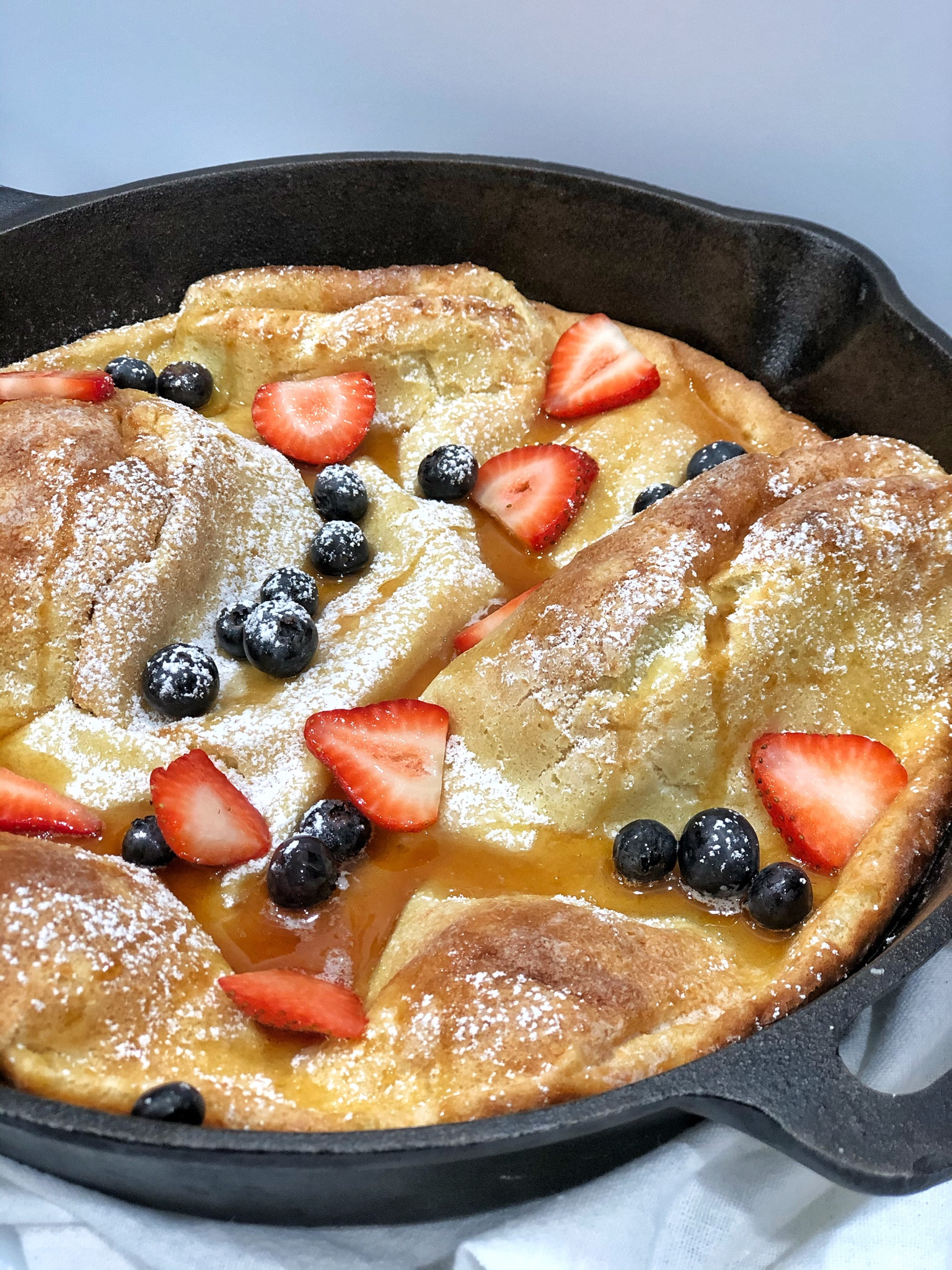 GIANT PUFF BERRY PANCAKE…perfect for July 4th weekend! 

INGREDIENTS
1 tablespoon butter
4 eggs
1 1/3 cups milk
1 teaspoon vanilla extract
3 tablespoons white sugar
1 1/2 cups flour
1/2 teaspoon salt
Toppings: strawberries, blueberries, powdered sugar, butter, maple syrup 

DIRECTIONS:
1. Preheat oven to 375F. 
2. Grease a cast iron skillet (or large baking dish) with butter. 
3. In a large bowl whisk together eggs, milk, vanilla and sugar. 
4. Add in the flour and salt, mix well. 
5. Pour batter into skillet. 
6. Bake for about 35 minutes or until golden brown. 
7. Remove from oven and top with berries, powdered sugar, butter and syrup. 

#castironskillet #pans #july4 

#LTKhome #LTKkids #LTKunder50