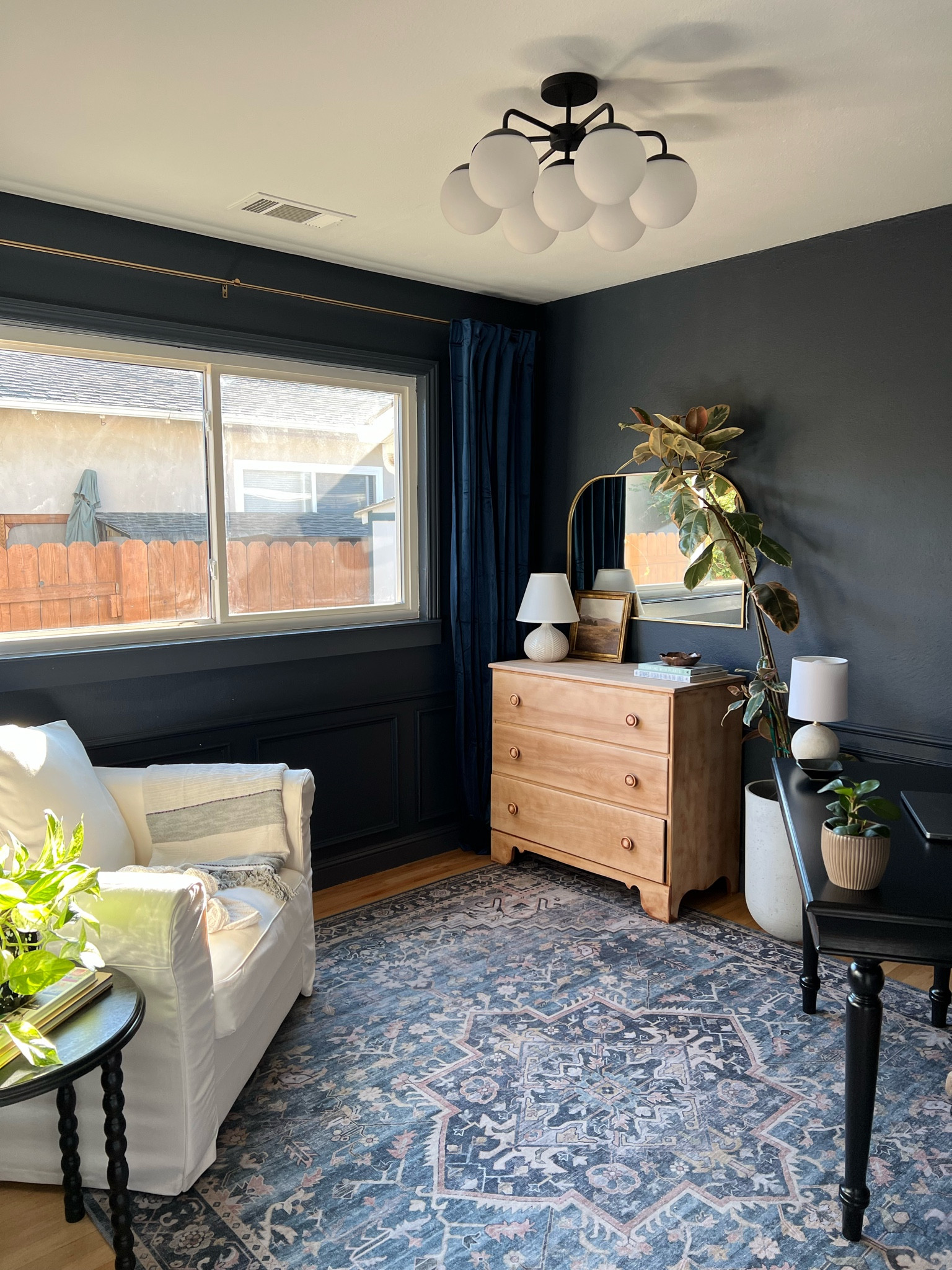 Office decor - blue rug, arched wall mirror, art, lamp

#LTKhome