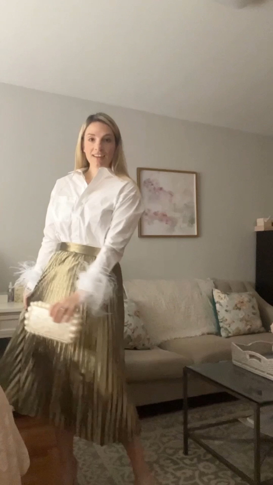 Holiday outfit. Gold pleated skirt - sold out but linked similar styles. Feather button down top. Christmas Eve outfit. Holiday party. Pearl clutch. Evening clutch. 
.
.
.
.
…  

#LTKitbag #LTKstyletip #LTKHoliday