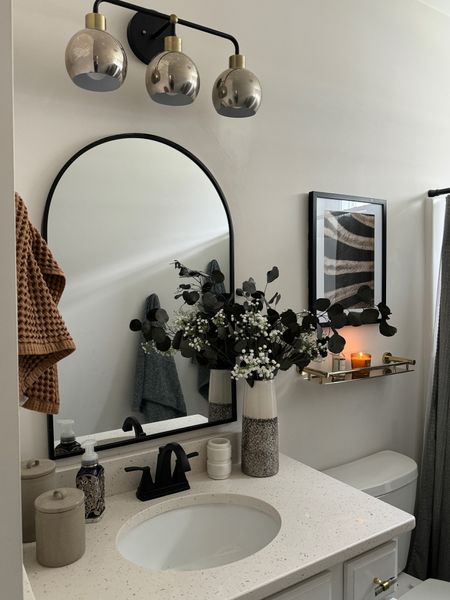 Guest bathroom refresh! Here’s a still image of gold shelf as well as all other decor. I’m loving it!

Home decor, guest bathroom, bathroom decor, wall art, arched mirror, sconces, vanity light, faux stems, towels 

#LTKFindsUnder50 #LTKSeasonal #LTKHome