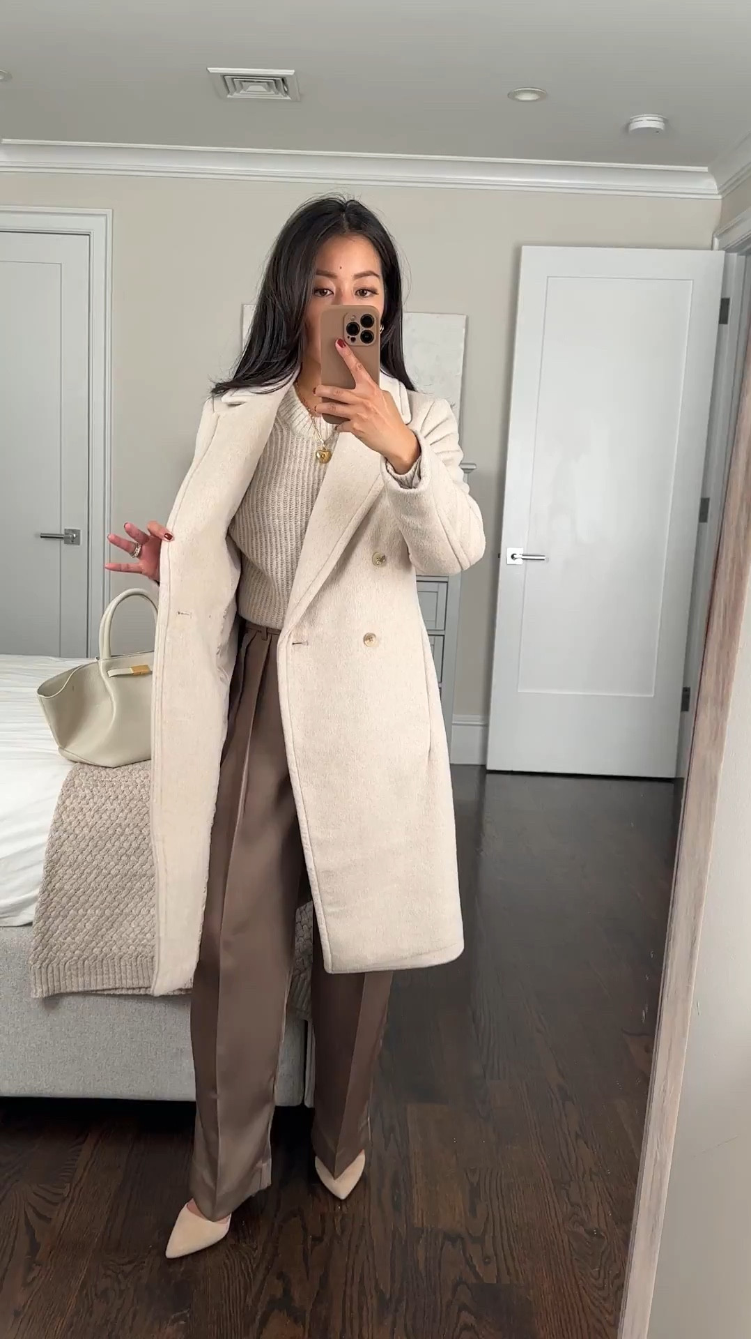Some sizes restocked in this coat and trench! Linked a few other petite sale finds too like $40 petite wide leg trousers ( discount applied in cart)

• banana republic factory winter wool blend coat. Also comes in brown, black, and herringbone

I am impressed by the thicker weight and fit for the price point!

Xxs petite is a classic fit on me, with room to layer a thicker sweater like I have on here. Some reviewers sized down for a slimmer fit. Thicker weight material, fully lined with pockets

• also trying their silky trousers in 00 petite. Slightly looser fit and mid rise. 

• Everlane alpaca sweater in xxs almond color. Prettiest color! This sweater feels itchier at first and softened up with wear for me over time. 

• demellier midi New York bag 

• sezane heart charm, chain sold separately 

Workwear, classic winter coat, winter white corporate office style

#LTKPetite #LTKSeasonal #LTKWorkwear