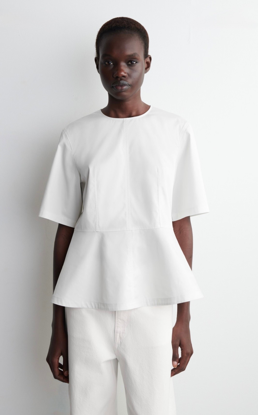 COTTON PEPLUM TOP

The womenswear team transforms classic silhouettes through considered shapes and premium fabrics. This modern blouse is crafted from airy cotton and designed with waist darts, a voluminous hem, and delicate ties at the back

#LTKParties #LTKWorkwear #LTKStyleTip