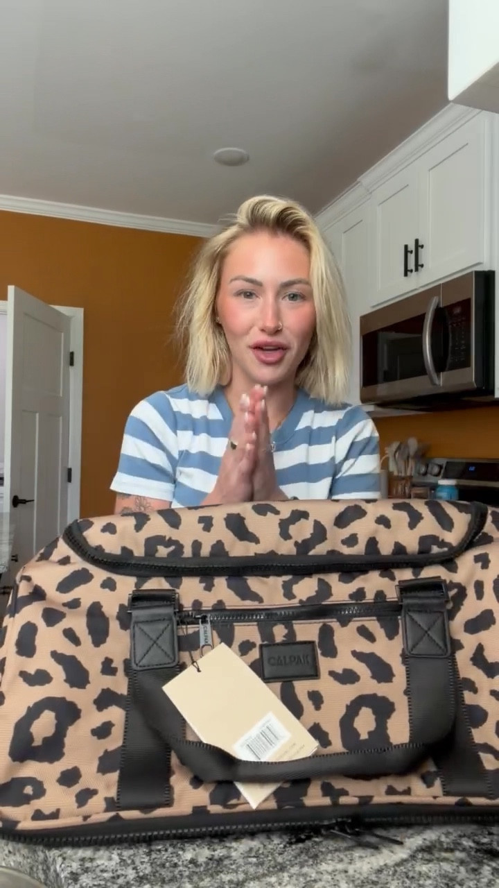 I am loving this new bag from @CALPAK  😍 I mean this pattern is PERFECT! And it’s going to be great for packing for my trip!! 

#ad #calpak