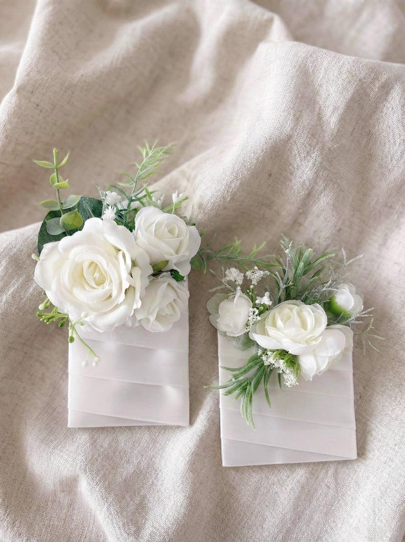 These elegant silk flower boutonnieres and corsages add the perfect finishing touch to your wedding party look. Designed with realistic blooms and soft eucalyptus accents, each piece brings a polished, romantic feel that coordinates beautifully with bridal bouquets and ceremony florals. Lightweight and easy to wear, they stay fresh and photo-ready all day—making them a lovely keepsake long after the celebration ends. #LTKwedding #weddingflowers #boutonniere #corsage #weddingdetails #bridalparty #weddinginspiration #silkflowers #bridestyle #weddingday 

#LTKWedding #LTKMens #LTKSeasonal