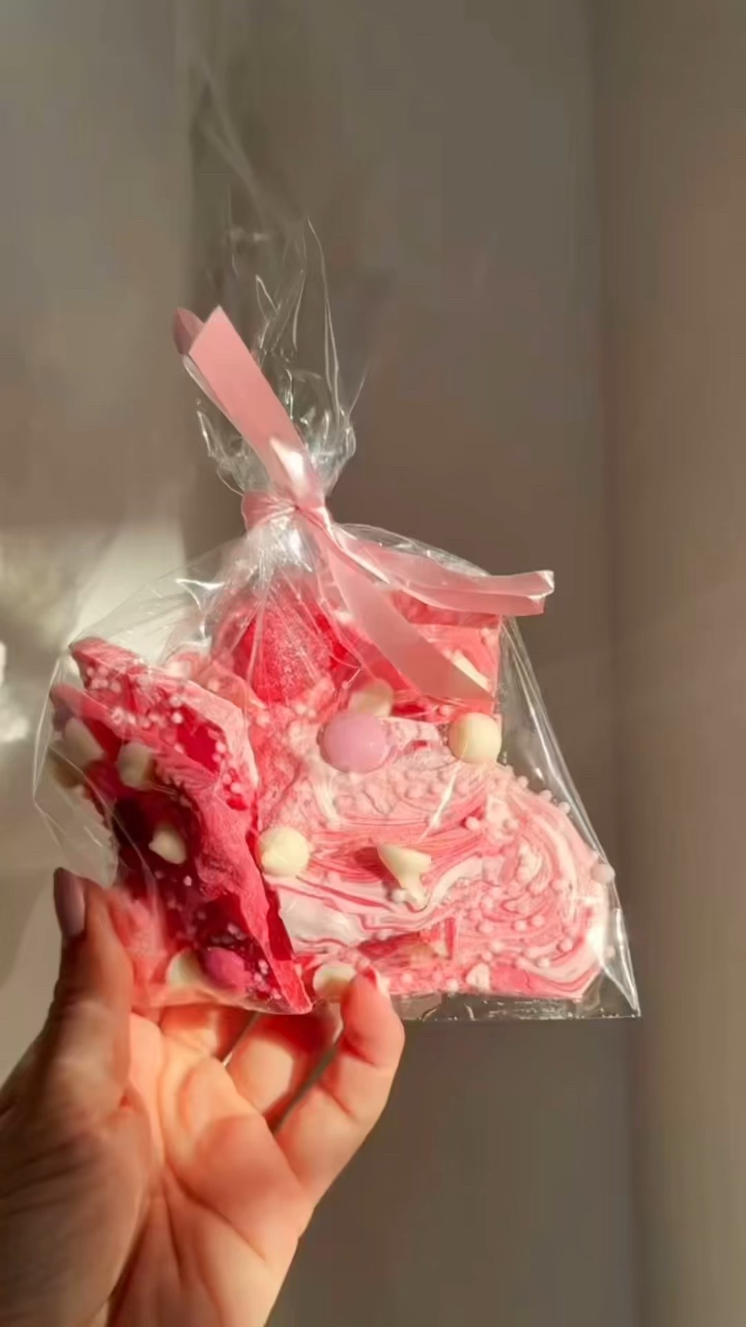 Making the dreamiest little Valentine treat for neighbors and friends 💗🍫  This white, pink, and red chocolate bark looks bakery-cute but is so easy …. the perfect “thinking of you” moment.  Line a baking sheet with parchment, melt your white chocolate, and spread it into a smooth layer. Drizzle pink and red chocolate on top, swirl it for that marbled magic, and finish with sprinkles or crushed strawberries. Let it set, break it apart, and tuck it into the cutest little bags.  A simple, sweet way to make someone’s day a little brighter 💘
 SHOP : https://amzn.markable.ai/GbanDIla  #valentinetreats  #valentinedessert  #valentinegifts  

#LTKSeasonal #LTKKids #LTKHome