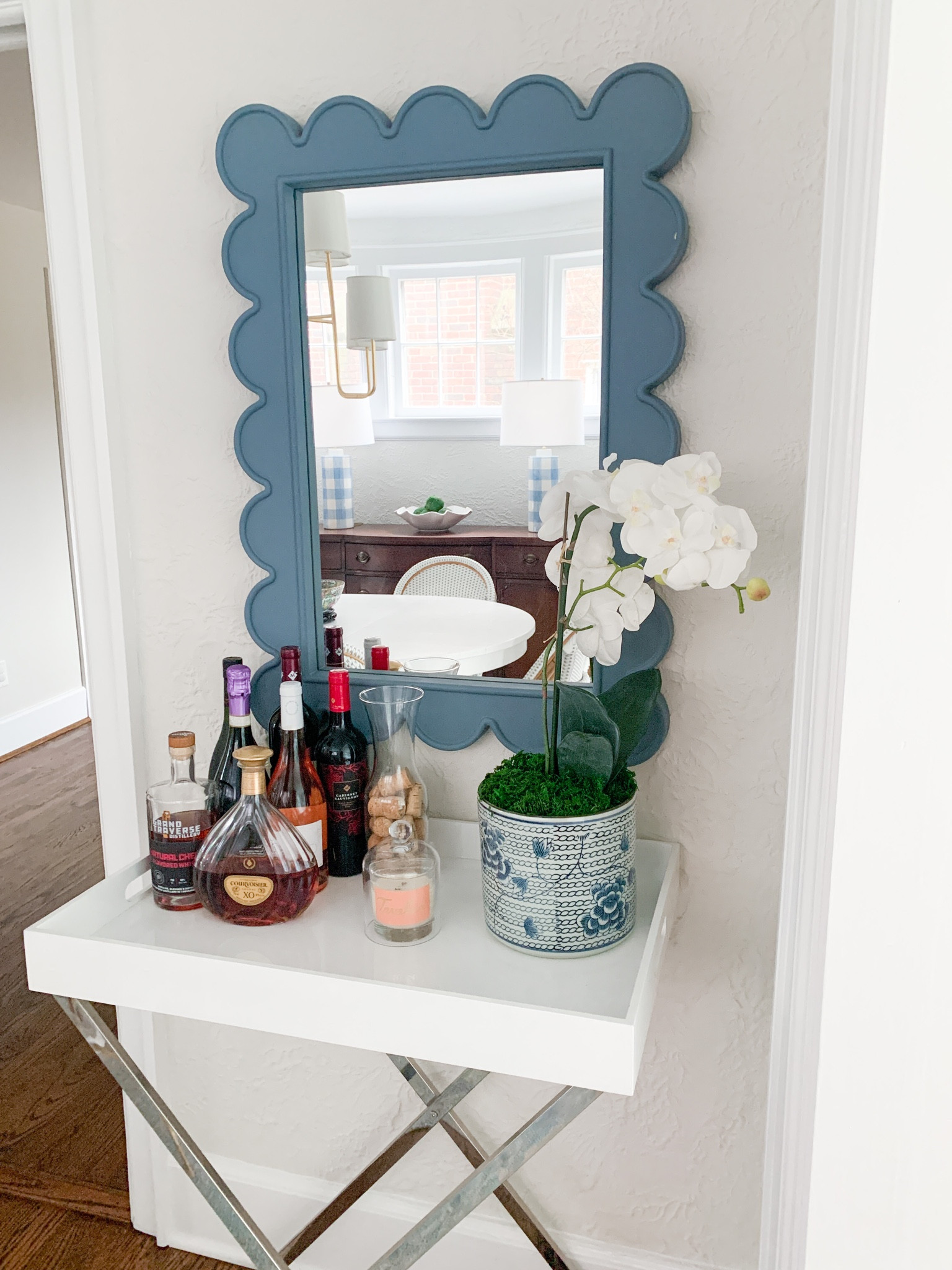 Faux orchid and scallop mirror both on sale!  Bar cart 

#LTKhome #LTKunder50 #LTKsalealert