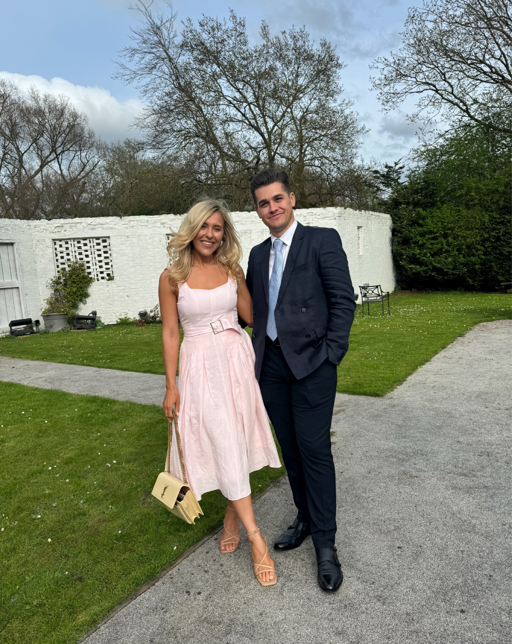 Wedding guest outfit - wedding guest dress - pink dress - baby pink dress - floaty dress - chiffon dress - nude heels - ysl bag - ysl sunset - saint laurent sunset bag - sunset handbag - nude handbag - chain handbag - wallet on chain - ysl luxury bag - ysl medium sunset bag - yves saint laurent bag - summer bag / designer bag - designer purse - wedding outfit - wedding dress - summer dress - karen millen dress 

#LTKspring #LTKeurope #LTKwedding