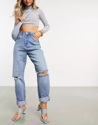 ASOS DESIGN high rise 'slouchy' mom jeans in midwash with rips | ASOS (Global)