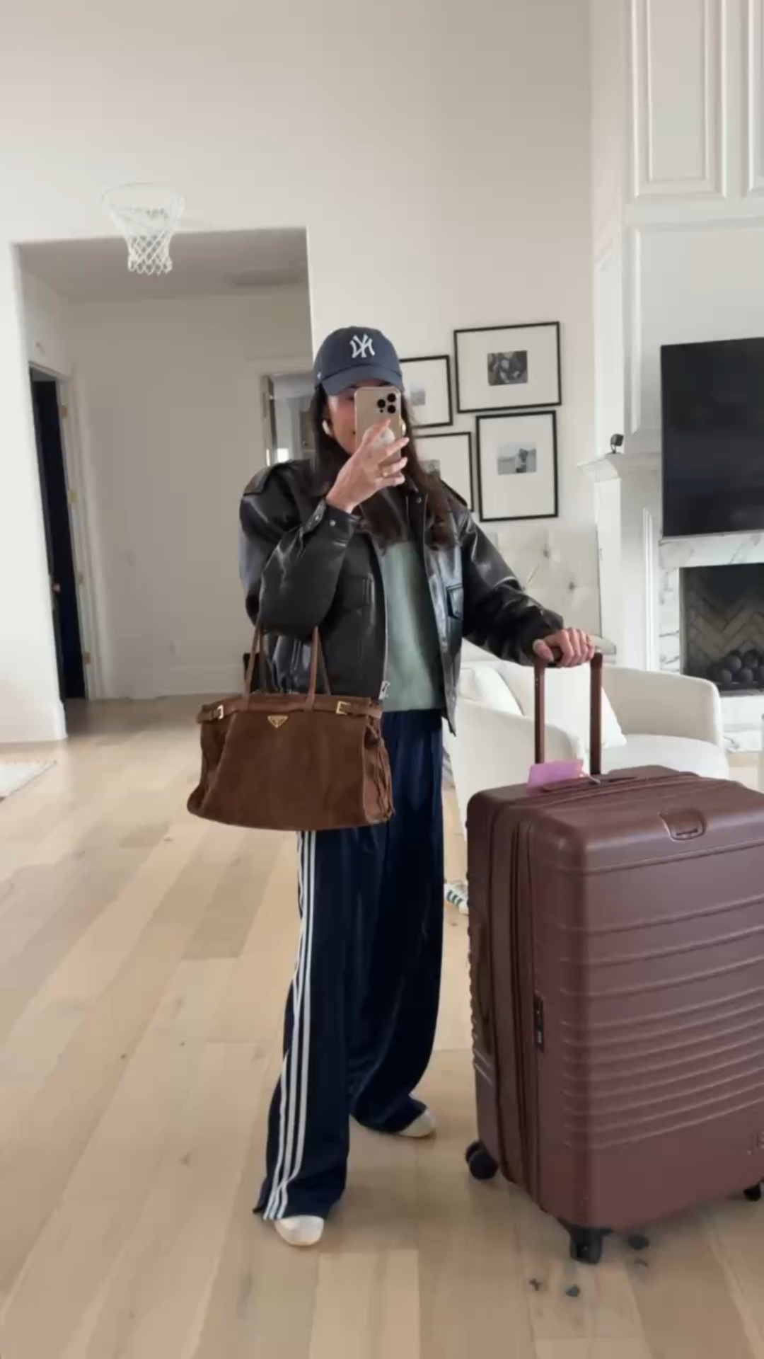 Quick trip travel outfit ✈️
@beis suitcase 
@finishline @adidas pants
@abercrombie mock neck sweatshirt 
@aritzia leather jacket 
@prada purse 

#LTKootd #LTKdayinmylife #LTKTravel