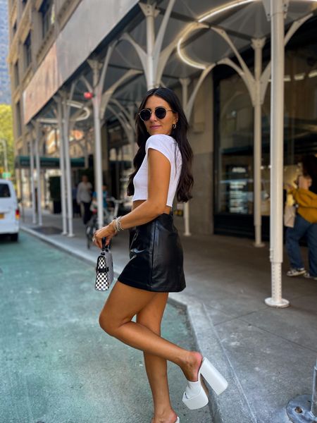 Edgy street style nyc outfit — leather skirt (small) white ribbed crop (small) white platform heels (size up 1/2 size)

#LTKSeasonal #LTKshoecrush #LTKstyletip