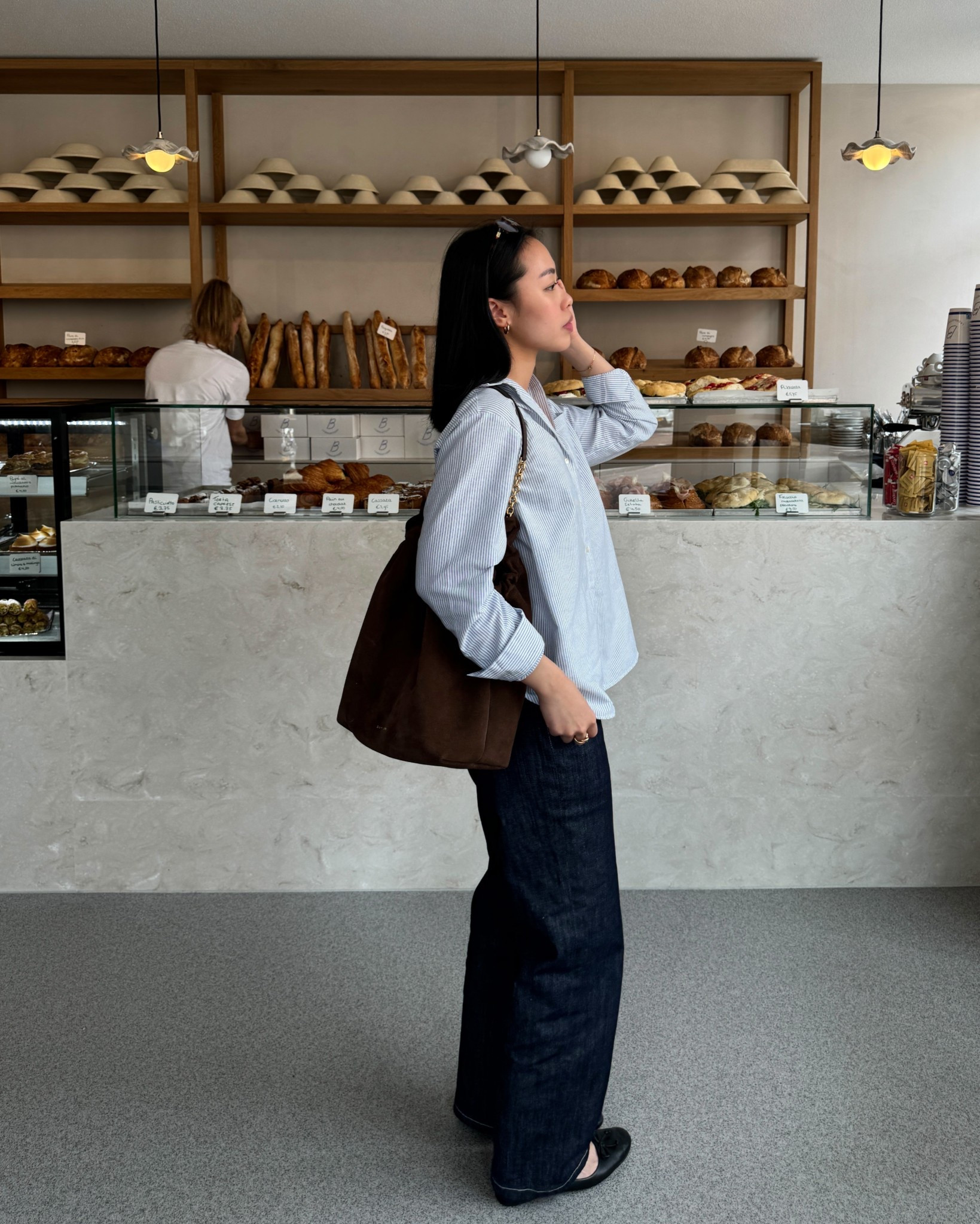 Spring outfit idea: striped shirt + jeans + chocolate brown suede bag + flats

#LTKSaleAlert #LTKStyleTip #LTKSeasonal