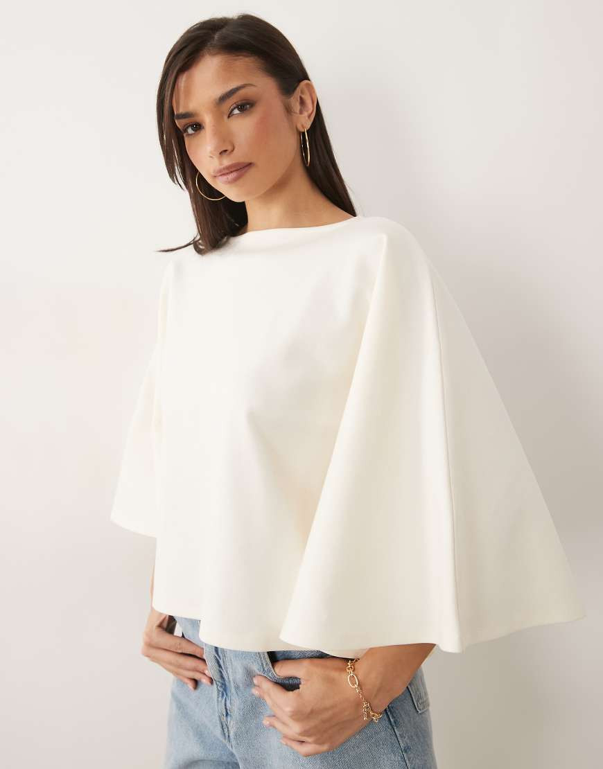 ASOS DESIGN interlock oversized cape style top in cream-White | ASOS (Global)
