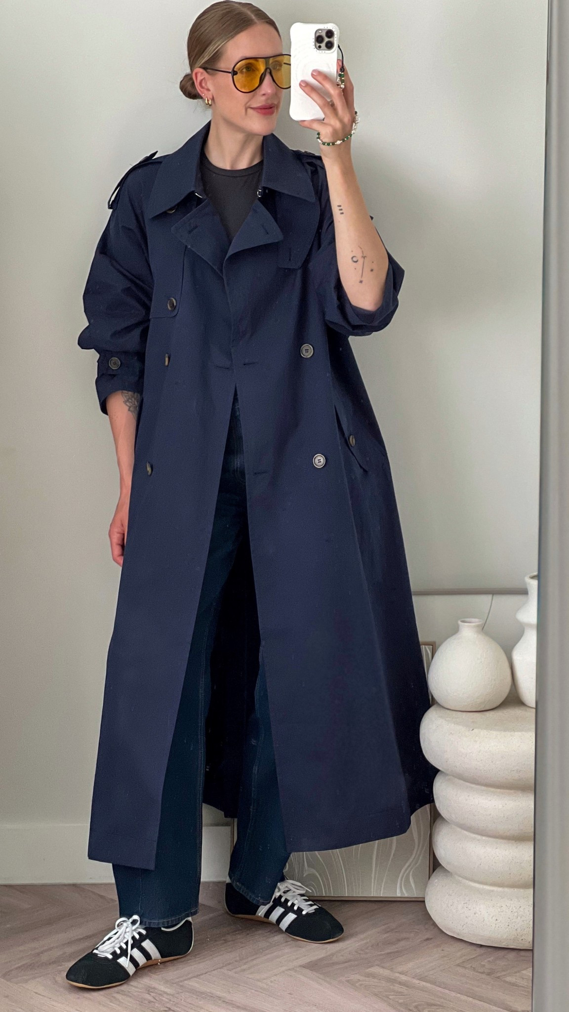 Navy trench coat - barrel leg jeans - Arket - Abercrombie - adidas Tokyo - trending trainers - yellow lens sunglasses - skims fits everybody tee 

#LTKspring #LTKuk #LTKshoes