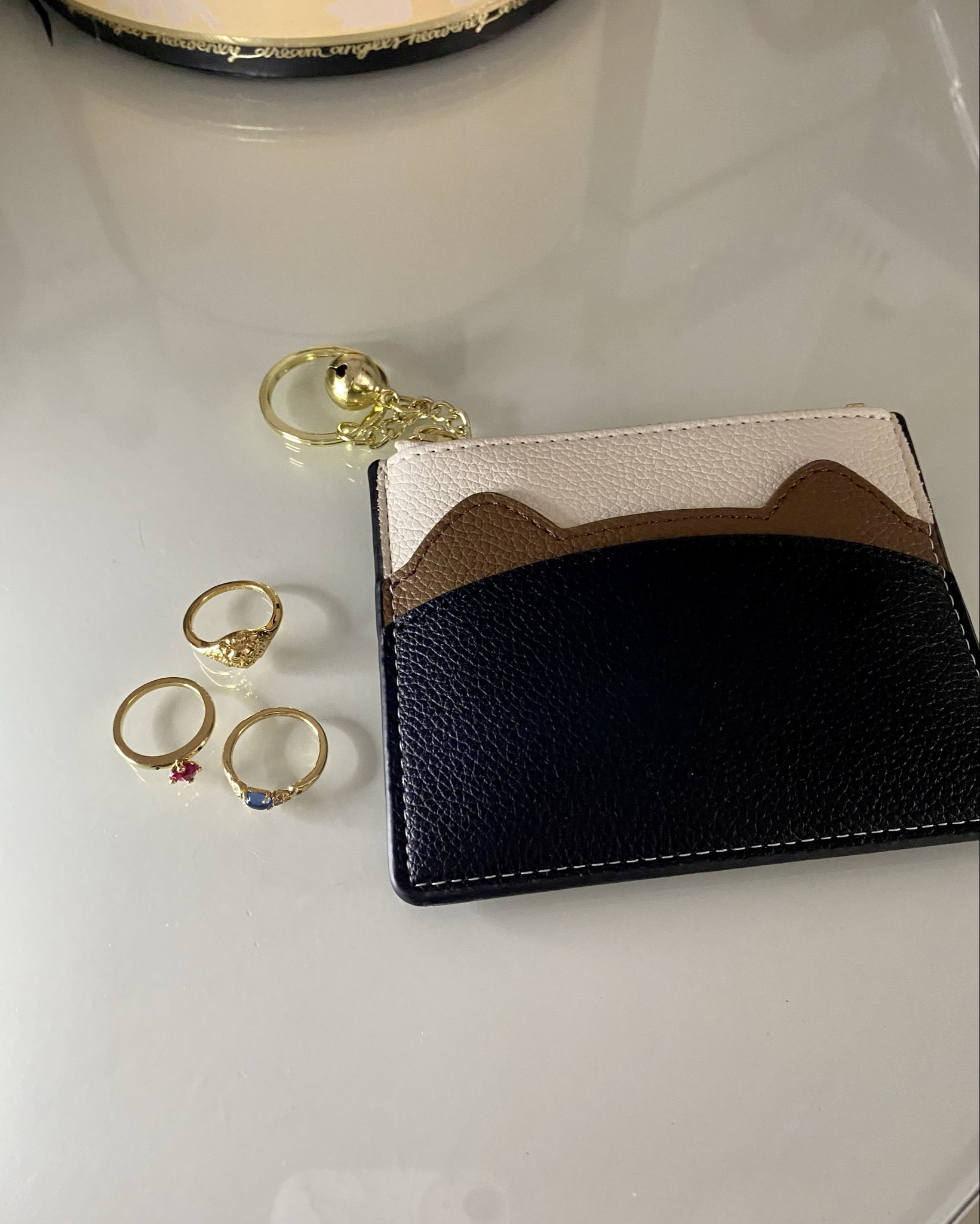 Neutral cat ears wallet and Pandora rings 😍

#LTKgrwm #LTKFindsUnder50 #LTKmorningroutine