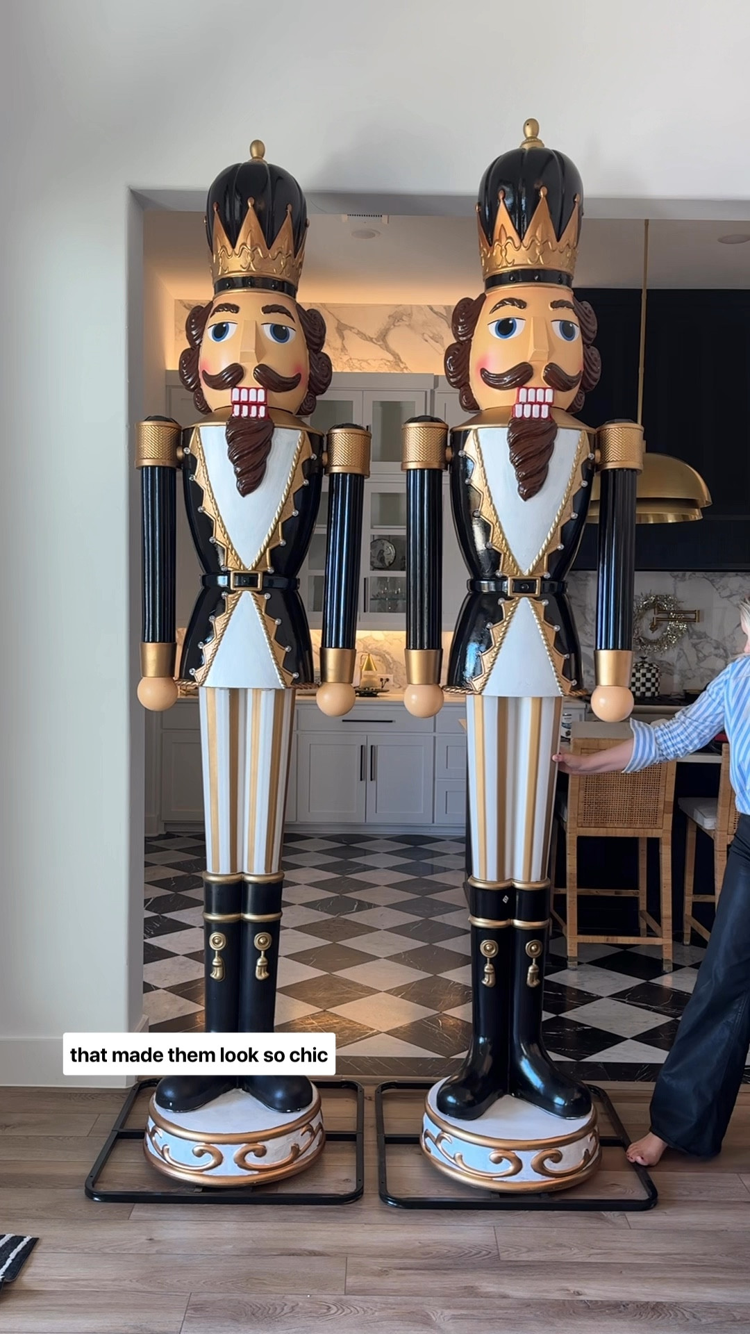 Watch me as a makeover of these viral 9 foot Walmart nutcrackers! I grabbed a quart of black-and-white paint and just made sure that it was outdoor quality with a primer. I used the bigger brush for the inside and a smaller brush for the edges. It only took about two coats to cover. I ordered black paint in a satin but it came in a gloss! I’m so happy because the shiny black coat looks incredible. I painted the  undercoat white but thankfully, I had such a small area because it definitely took three or four coats. This was such an easy DIY that made them look so chic and glam!#LTKHoliday 

#LTKHome #LTKSeasonal