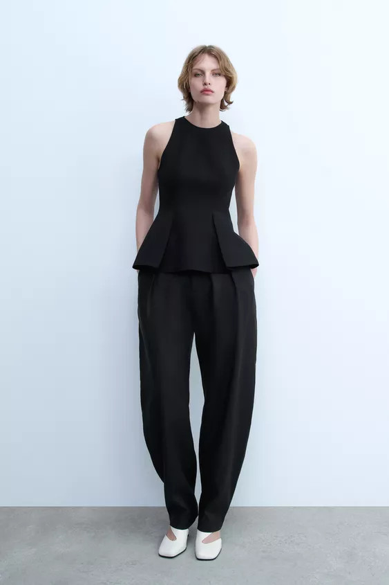 ZARA WOMAN COLLECTIONRound neck sleeveless top. Pleated peplum hem detail. Concealed zip fastenin... | Zara UK