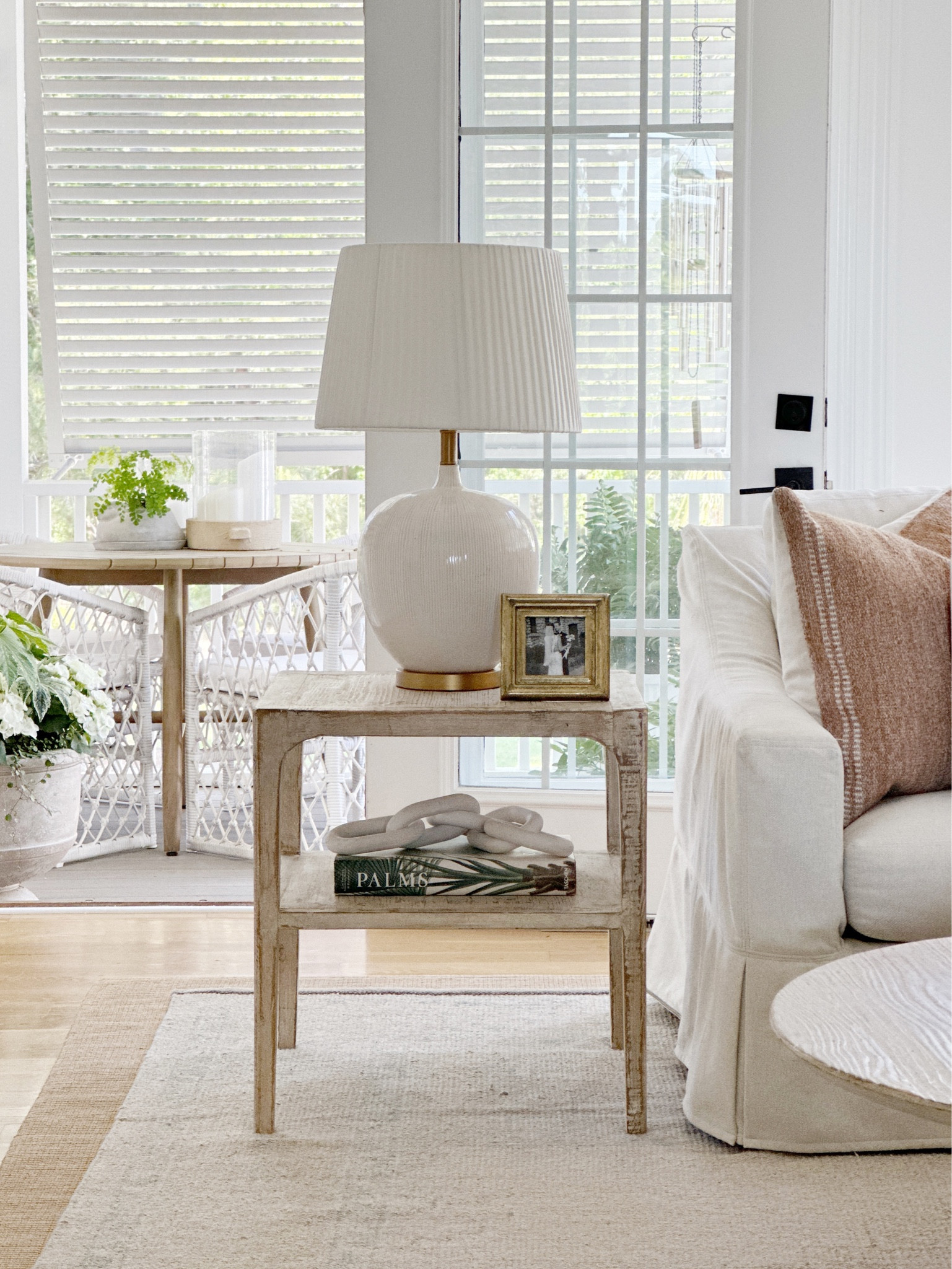 Coastal home with spring porch decor - Serena Lily chairs Target table hearth and hand pottery barn rug OKA lamp timeless patio outdoor furniture 

#LTKunder100 #LTKsalealert #LTKSeasonal