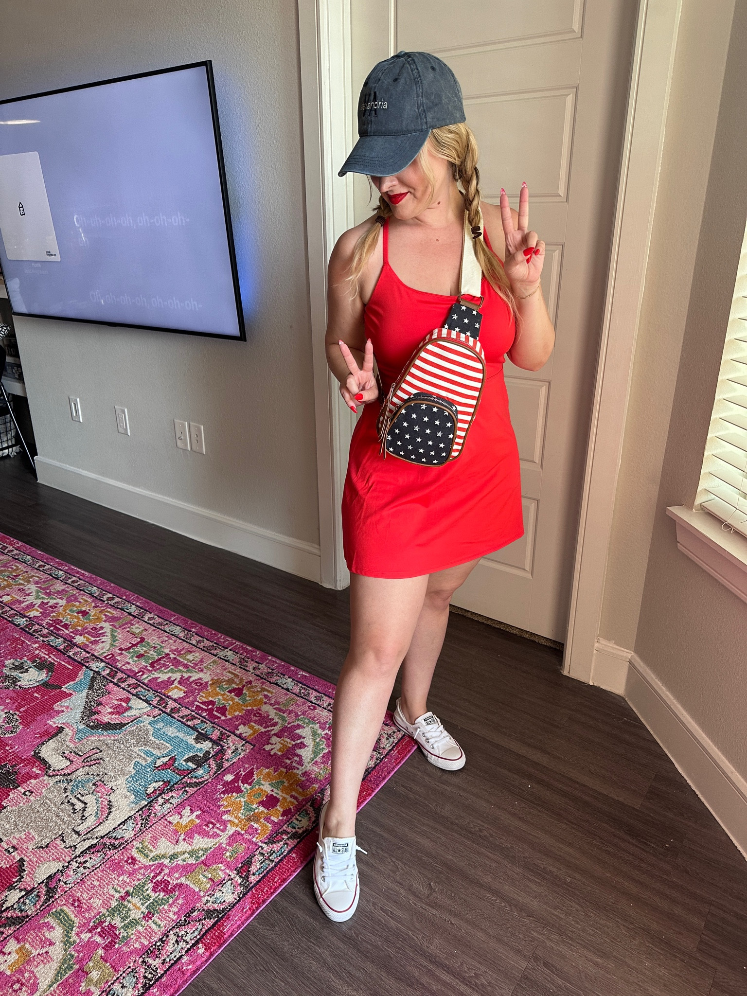 4th of July outfit for hot weather — Americana sling bag, distressed denim ball cap, red athletic tank dress, what to wear for outdoor 4th of July outting.  

#LTKFitness #LTKSummerSales #LTKSeasonal